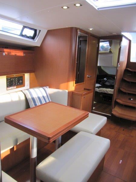 Beneteau-Oceanis 45 2015-Hey Jude III WA-US-Interior of 2015 Beneteau Oceanis 45 yacht with wooden furnishings and cozy seating area.-9598888 | Thumbnail