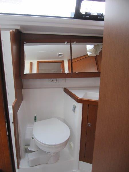 Beneteau-Oceanis 45 2015-Hey Jude III WA-US-2015 Beneteau Oceanis 45 yacht bathroom with wooden cabinetry and compact toilet.-9598888 | Thumbnail