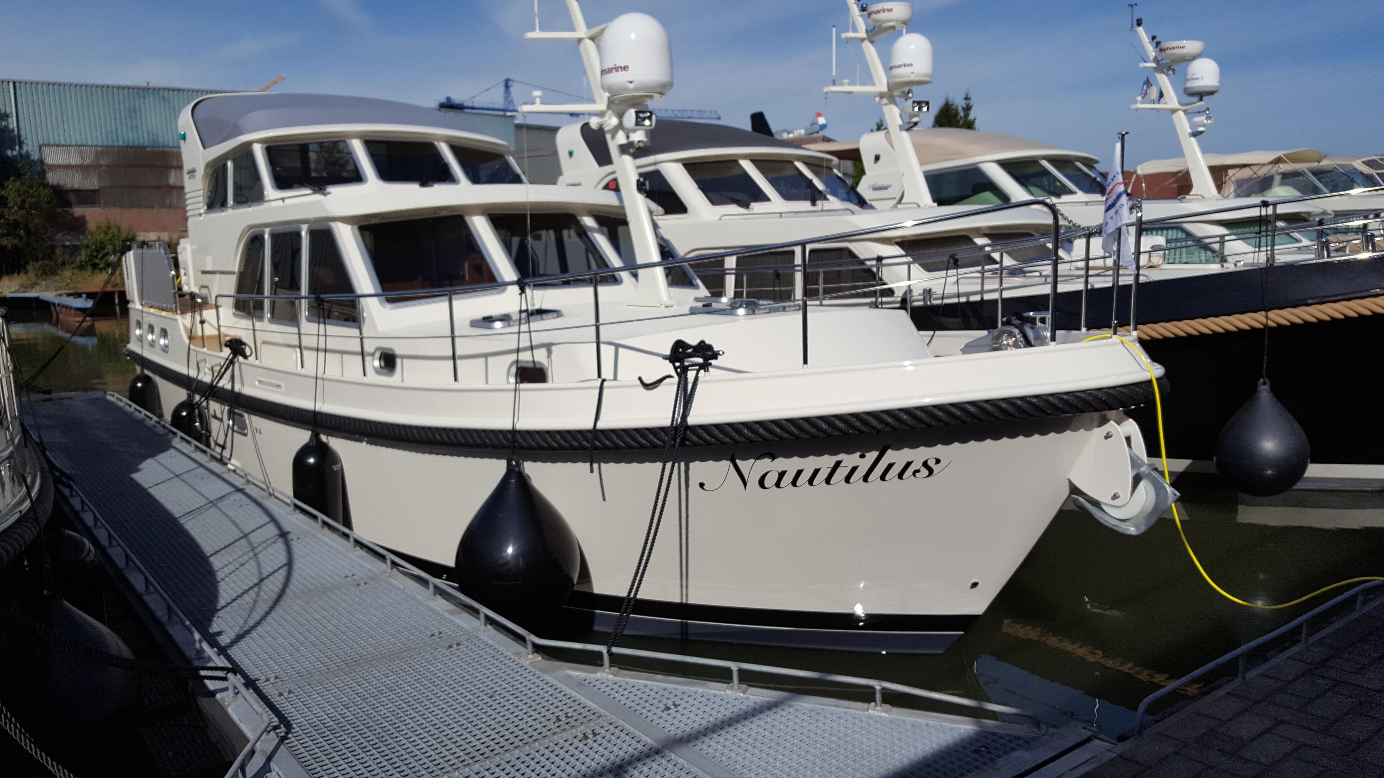 Linssen Grand Sturdy 410 AC Variotop 2016 yacht docked, featuring elegant design and modern amenities.