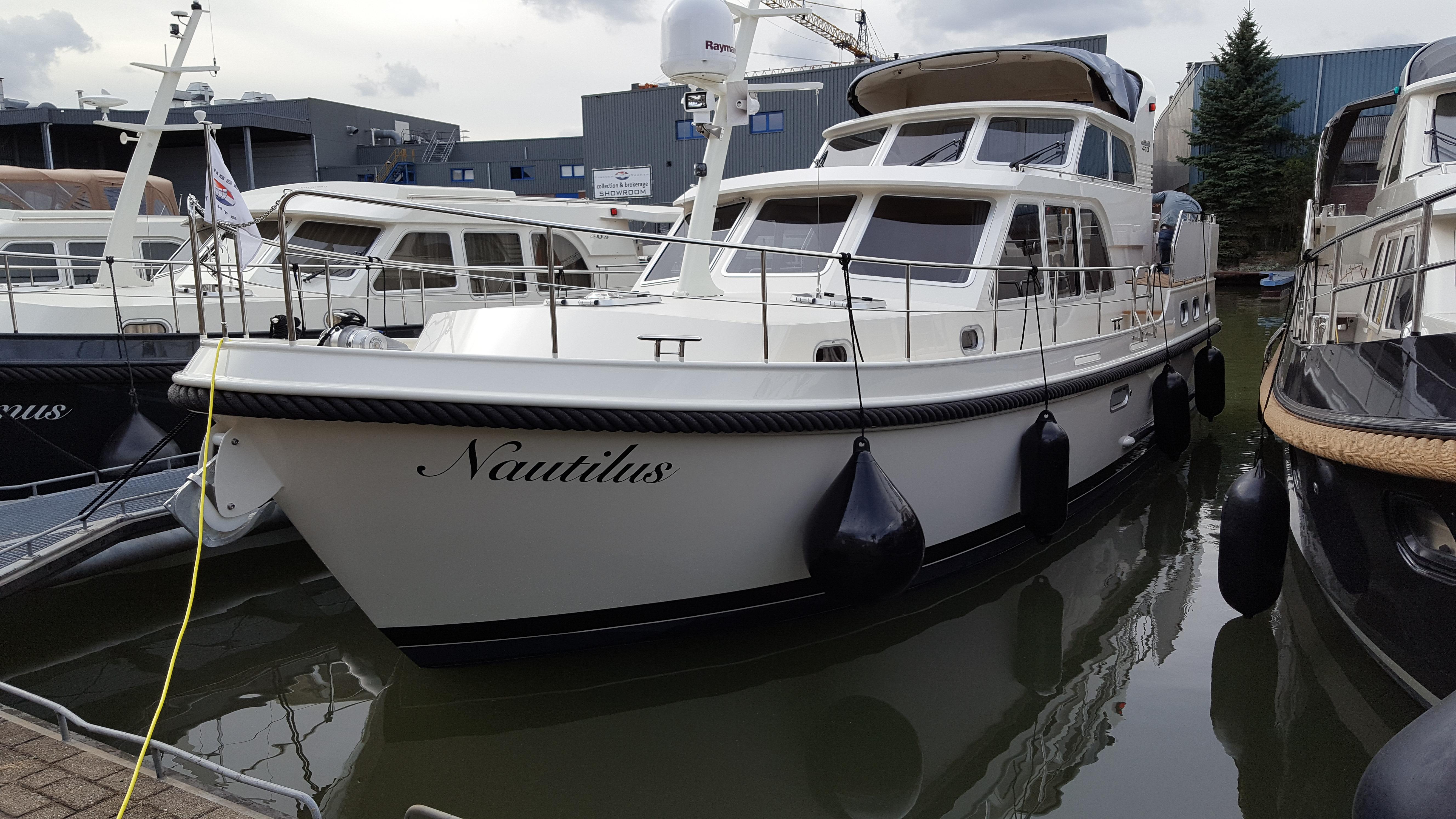 2016 Linssen Grand Sturdy 410 AC Variotop yacht docked in marina.
