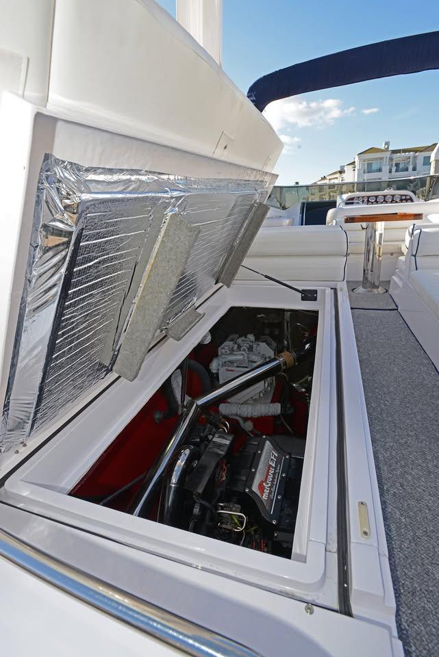 1994 Sunseeker Apache 45 engine compartment with open hatch, showcasing mechanical details.