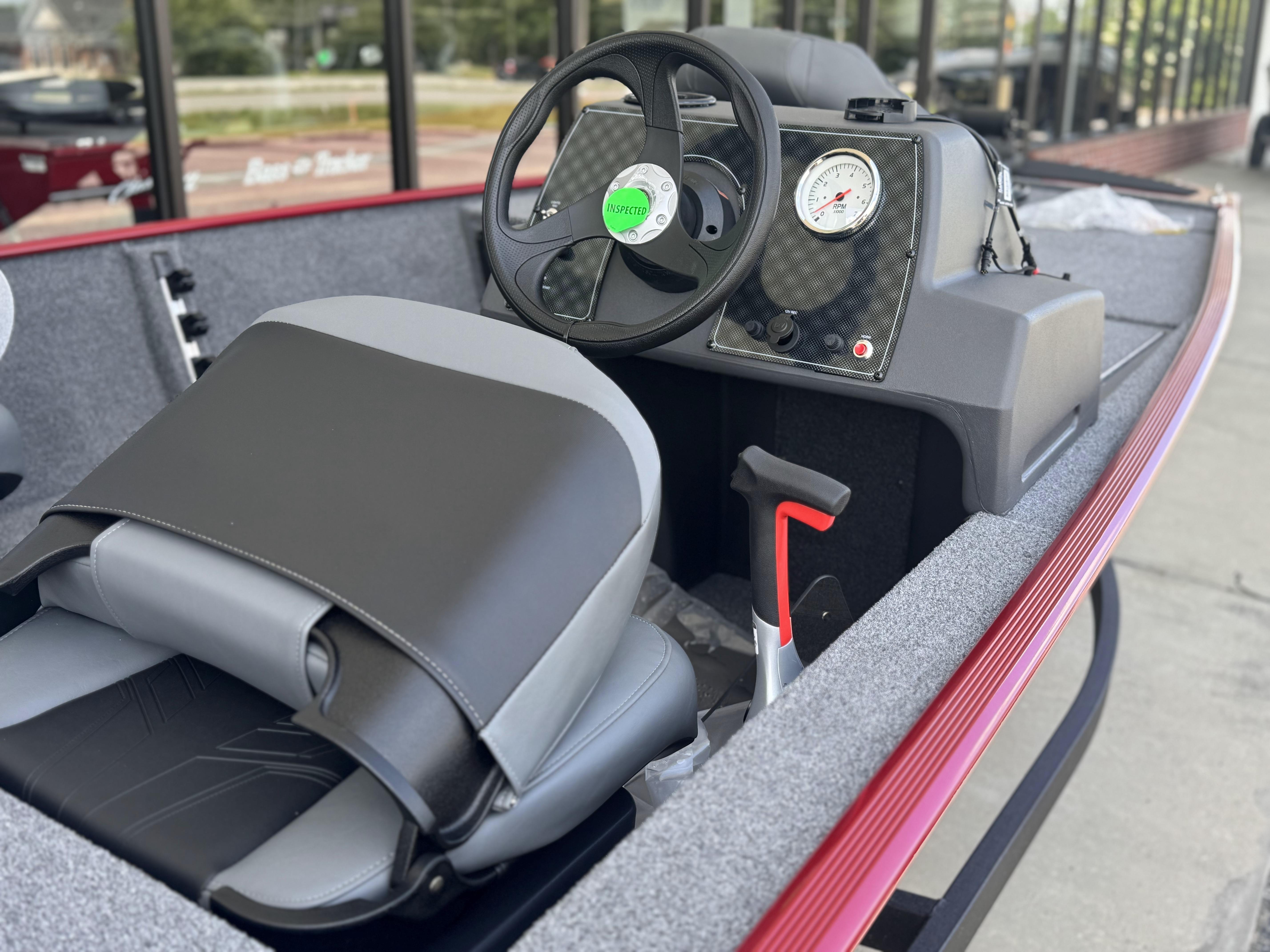 2025 Tracker Bass Tracker Classic XL boat interior with steering wheel and seat.