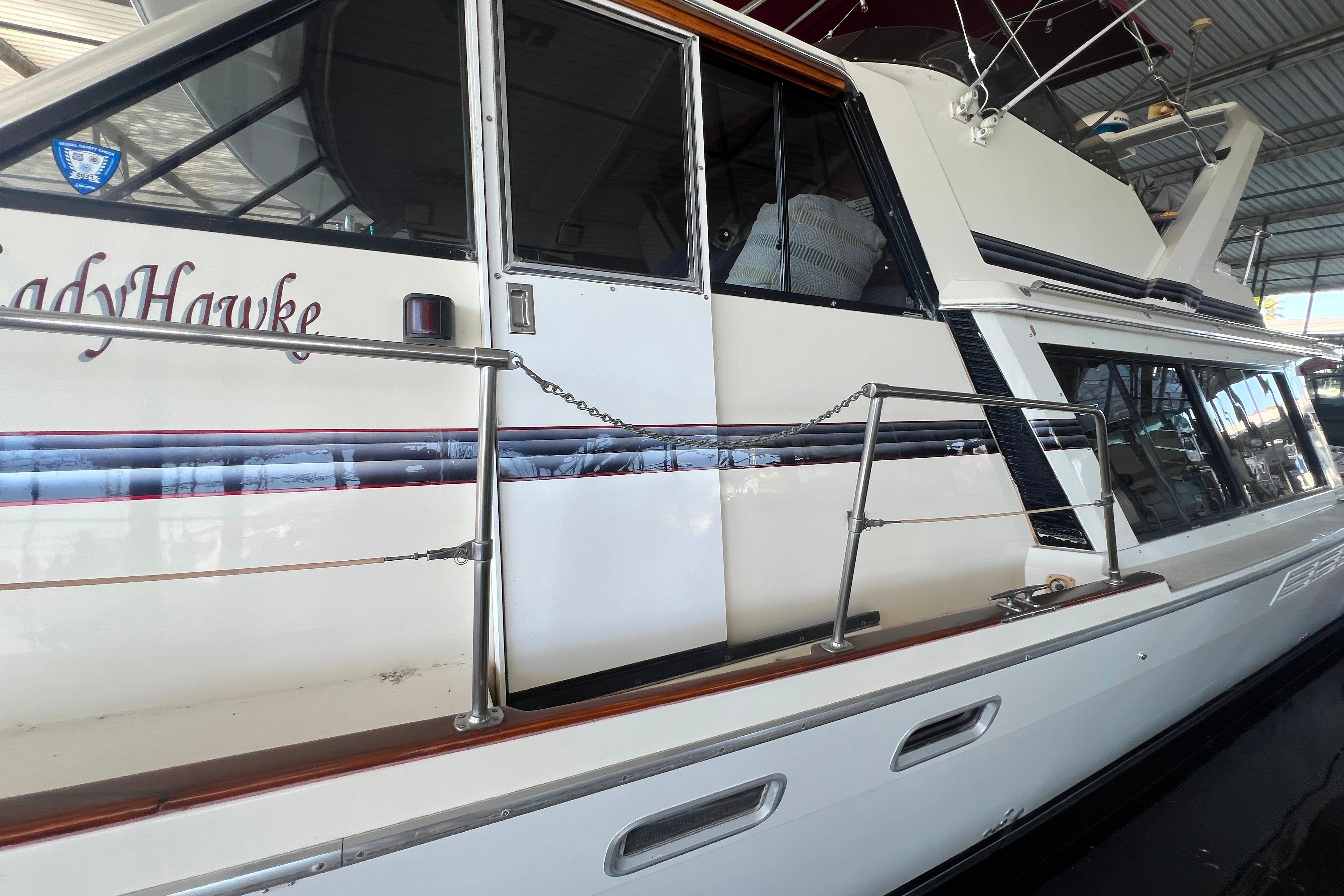 1986 Bayliner 4550 Motoryacht docked in a covered marina.