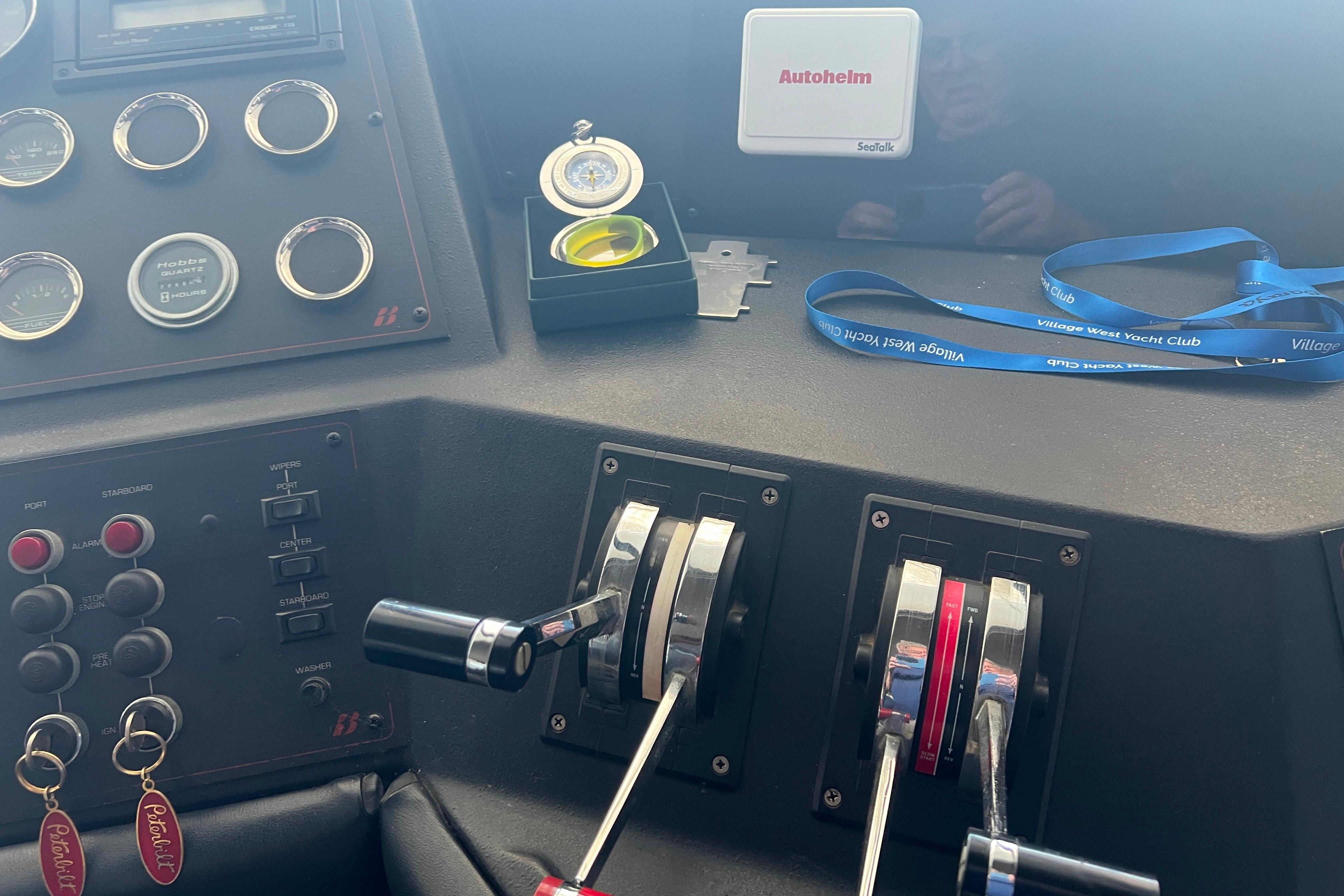 Control panel of 1986 Bayliner 4550 Motoryacht with gauges and throttle levers.