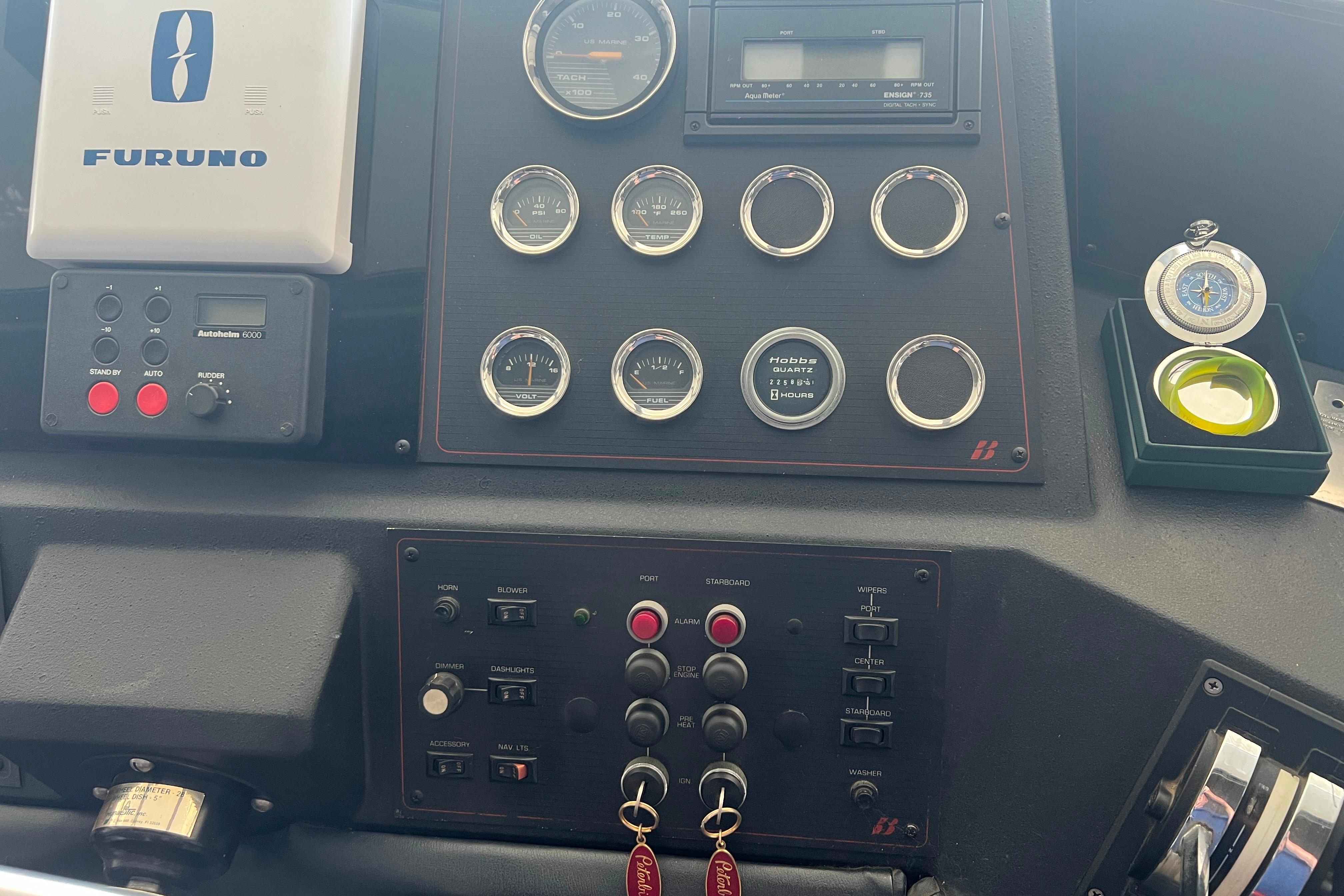 Control panel of 1986 Bayliner 4550 Motoryacht with gauges and navigation equipment.