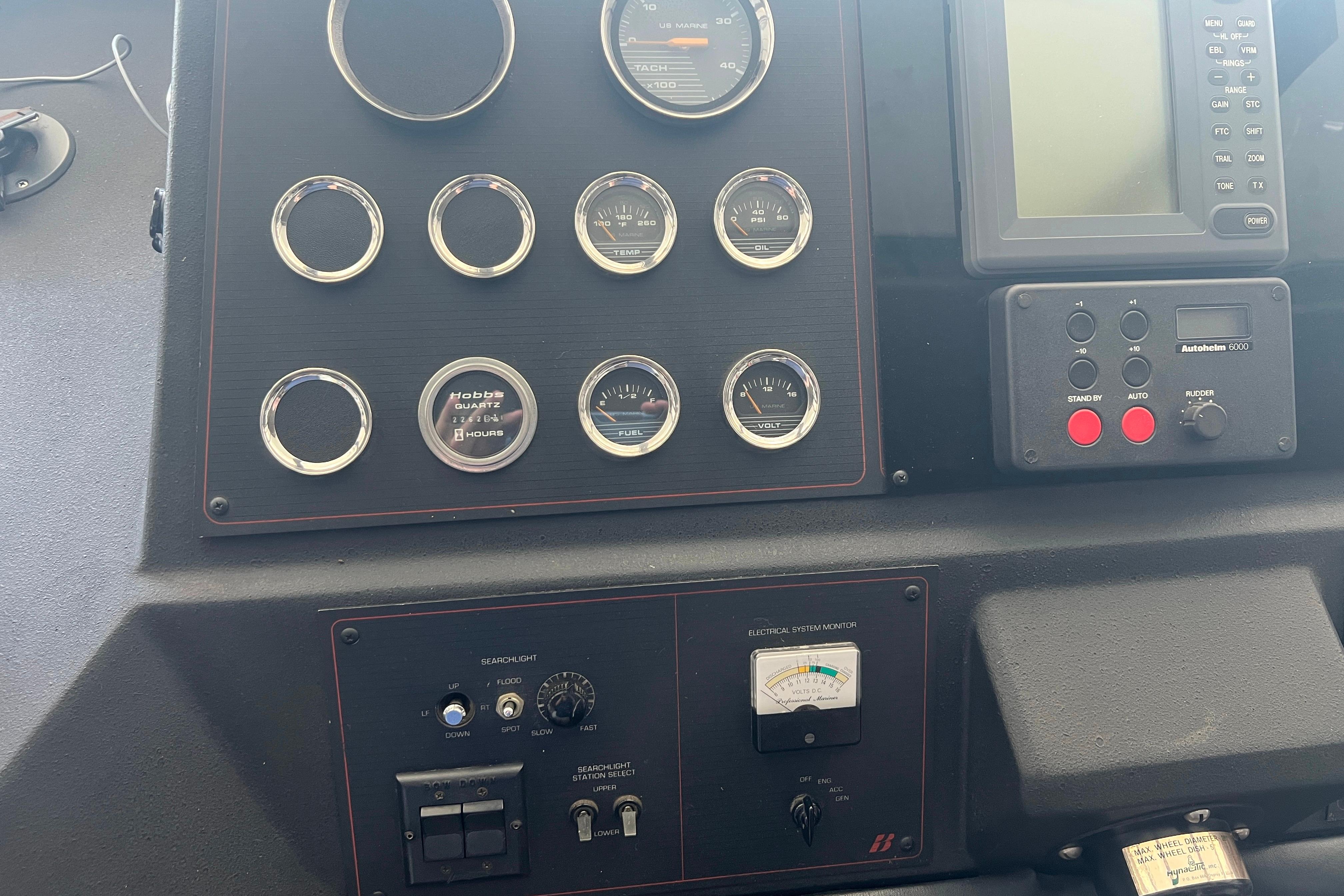 Control panel of a 1986 Bayliner 4550 Motoryacht with gauges and navigation equipment.
