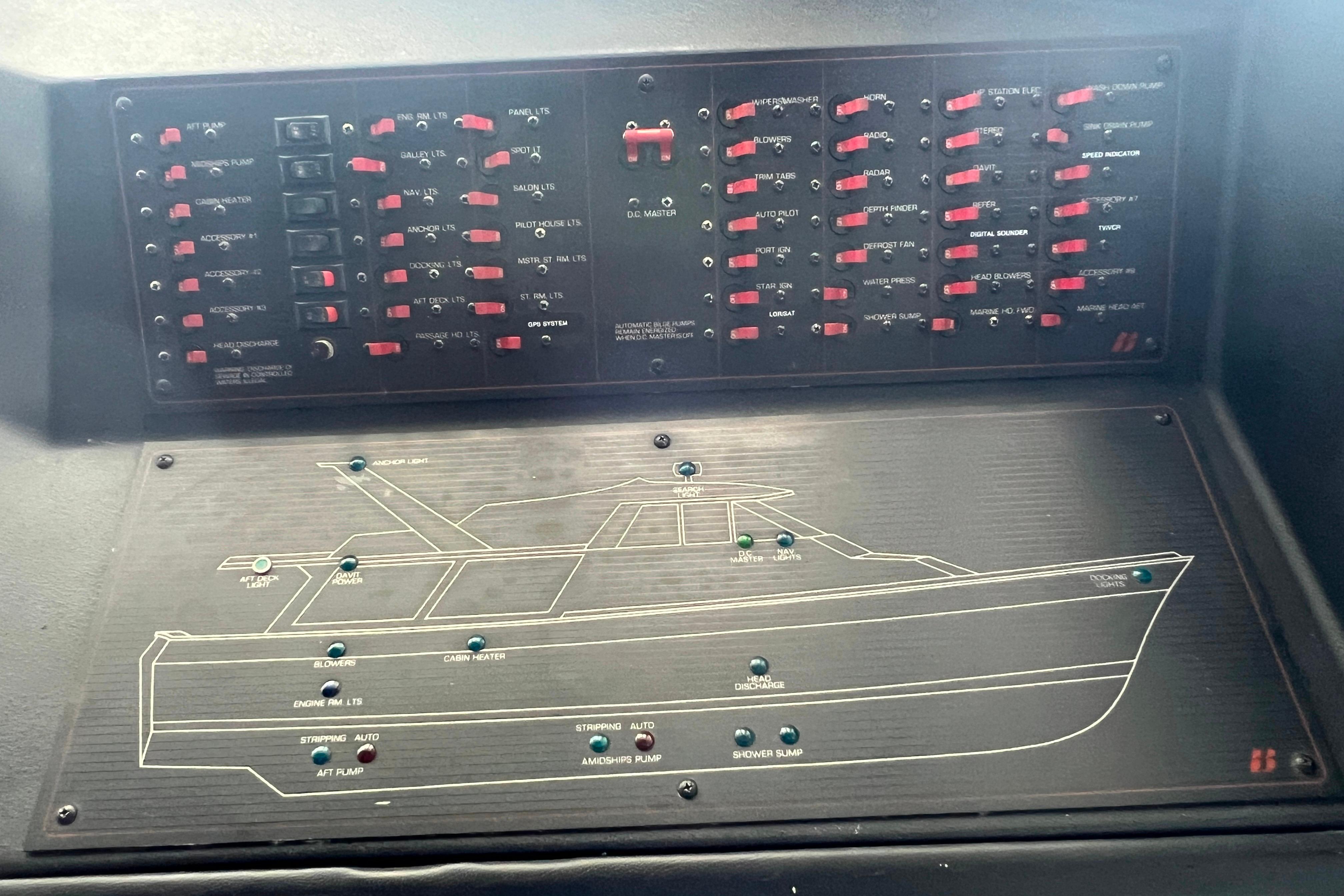 Control panel of a 1986 Bayliner 4550 Motoryacht with labeled switches and diagram.