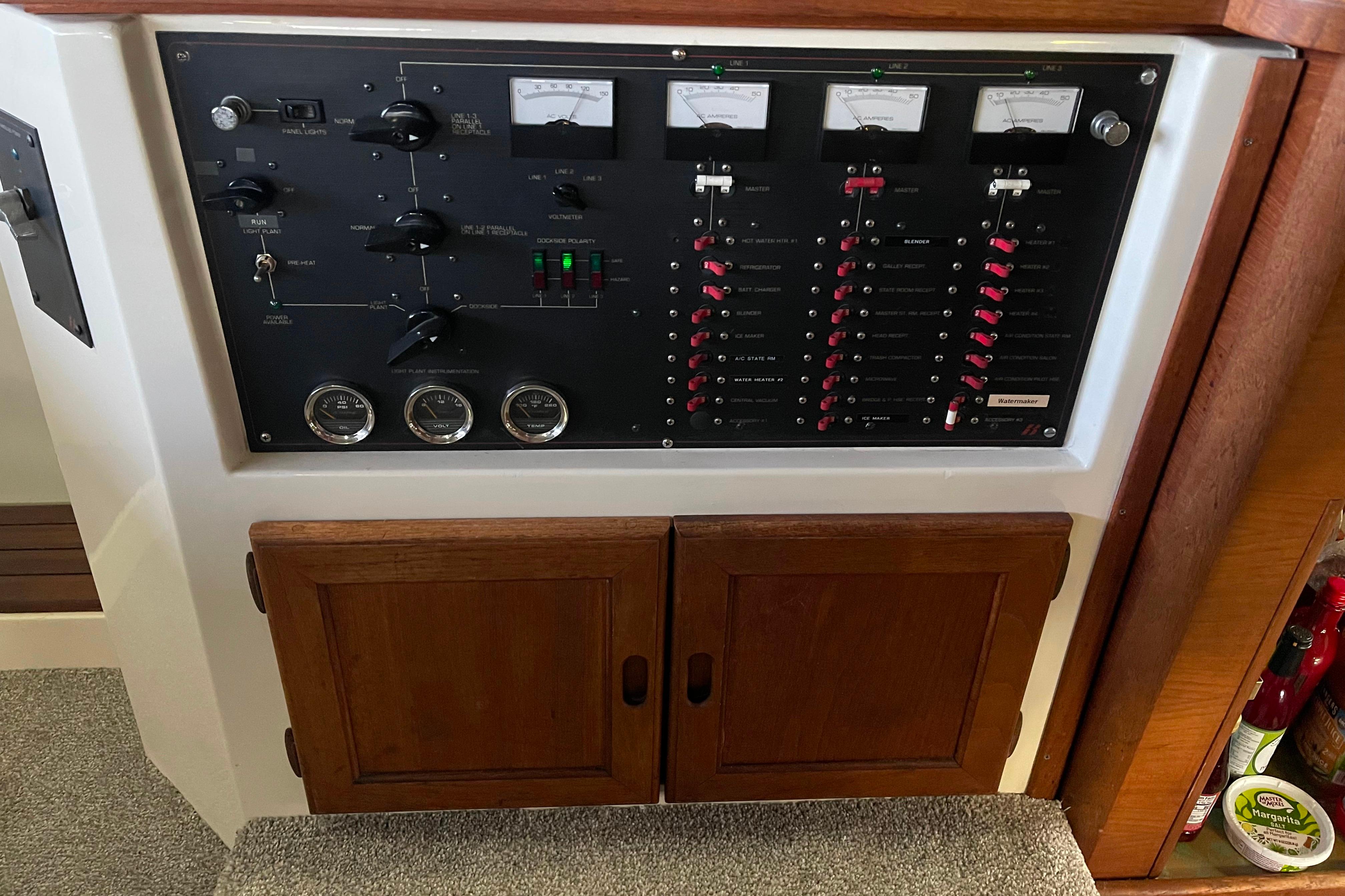 Electrical control panel on a 1986 Bayliner 4550 Motoryacht, featuring gauges and switches.