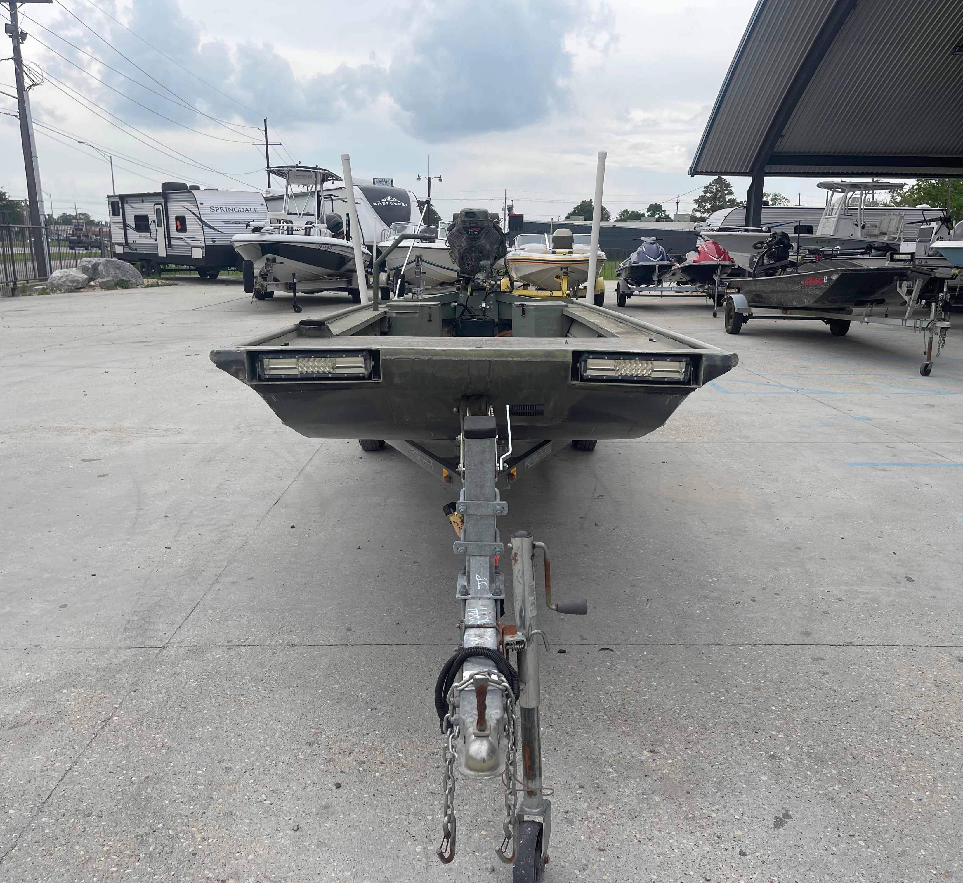 2016 WeldBilt 18x48 boat on trailer in outdoor storage area.