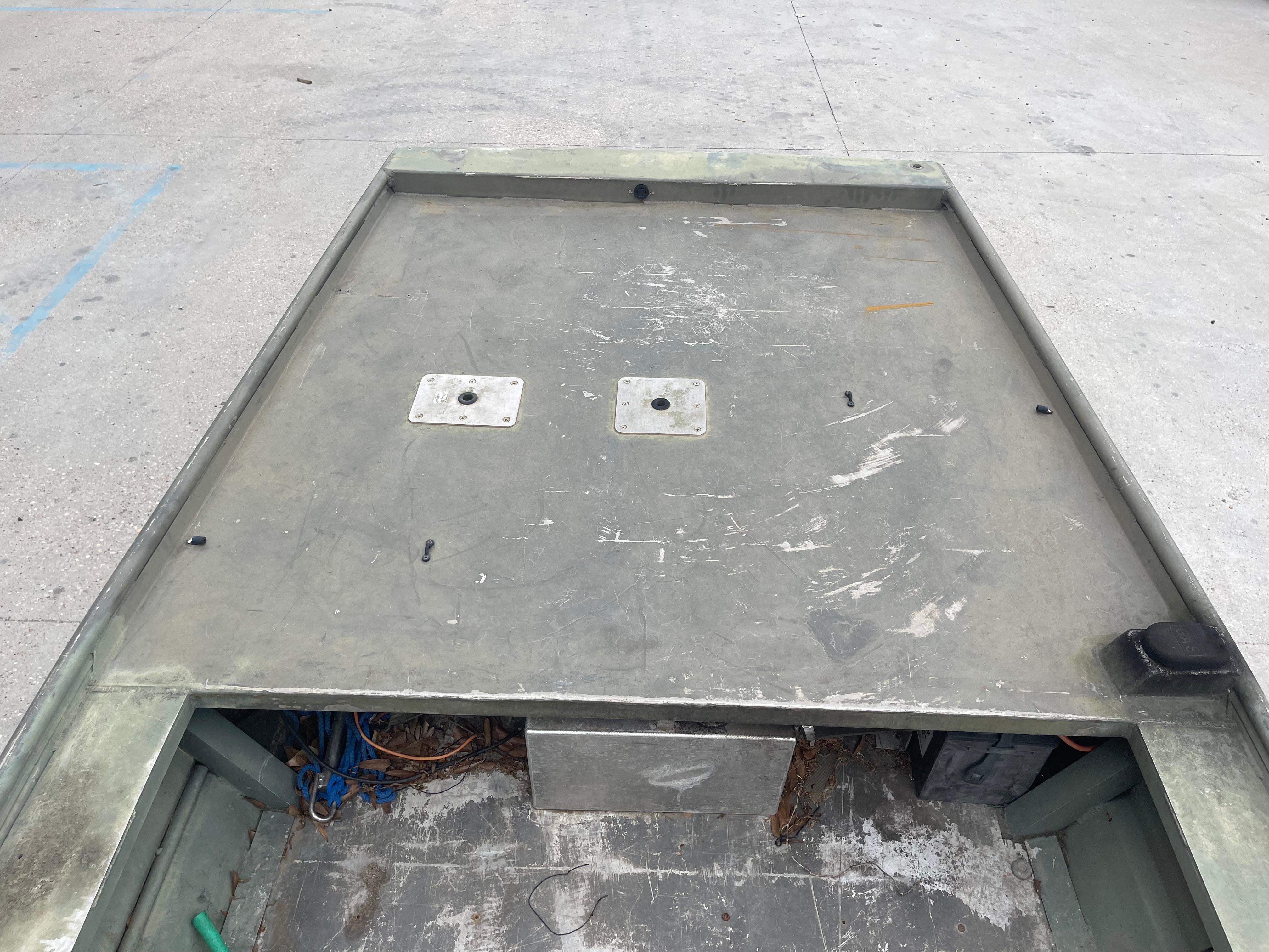 2016 WeldBilt 18x48 aluminum boat deck with storage compartment.