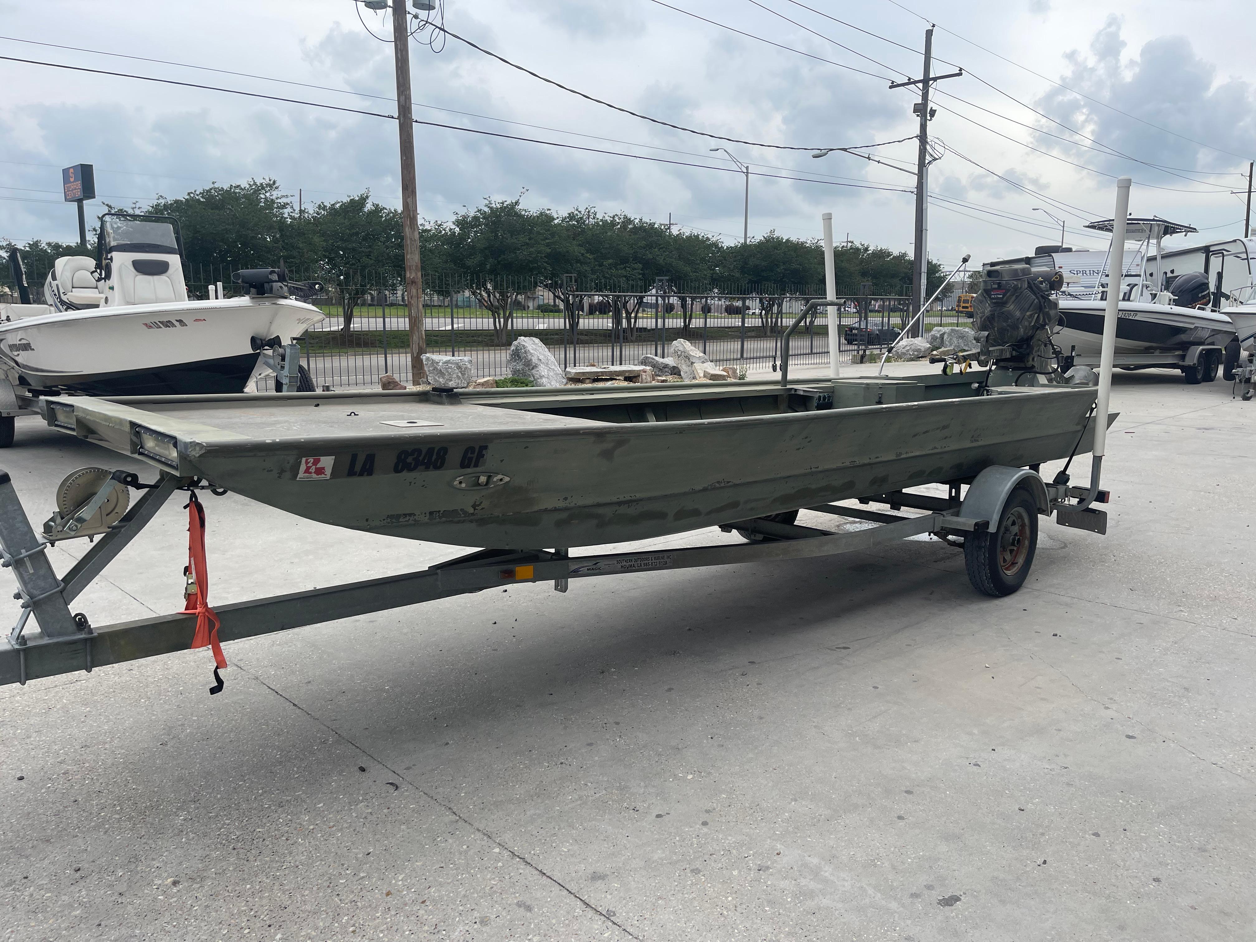 2016 WeldBilt 18x48 boat on trailer in parking lot.