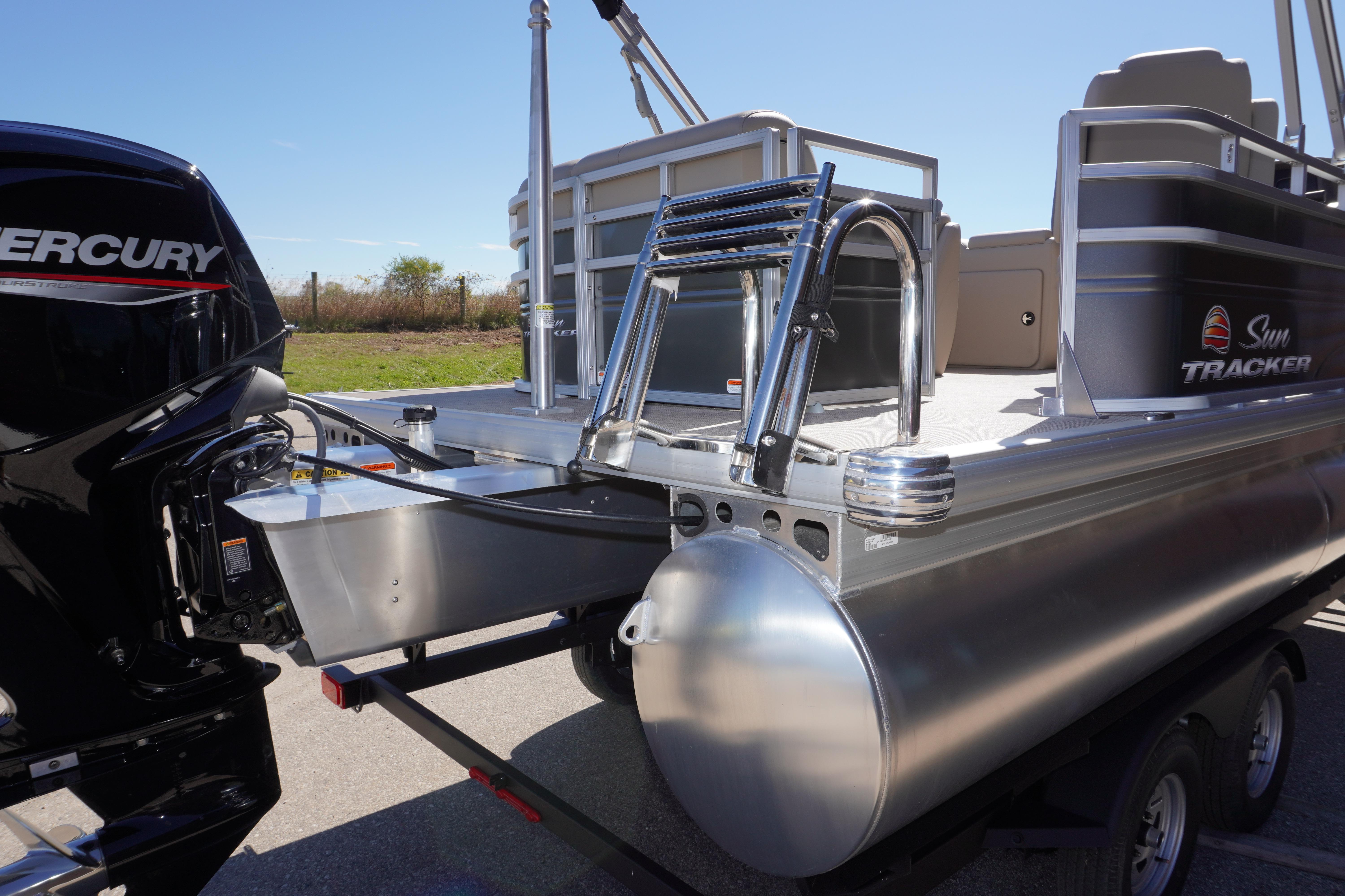 2024 Sun Tracker Party Barge 20 DLX pontoon boat with Mercury engine, rear view.
