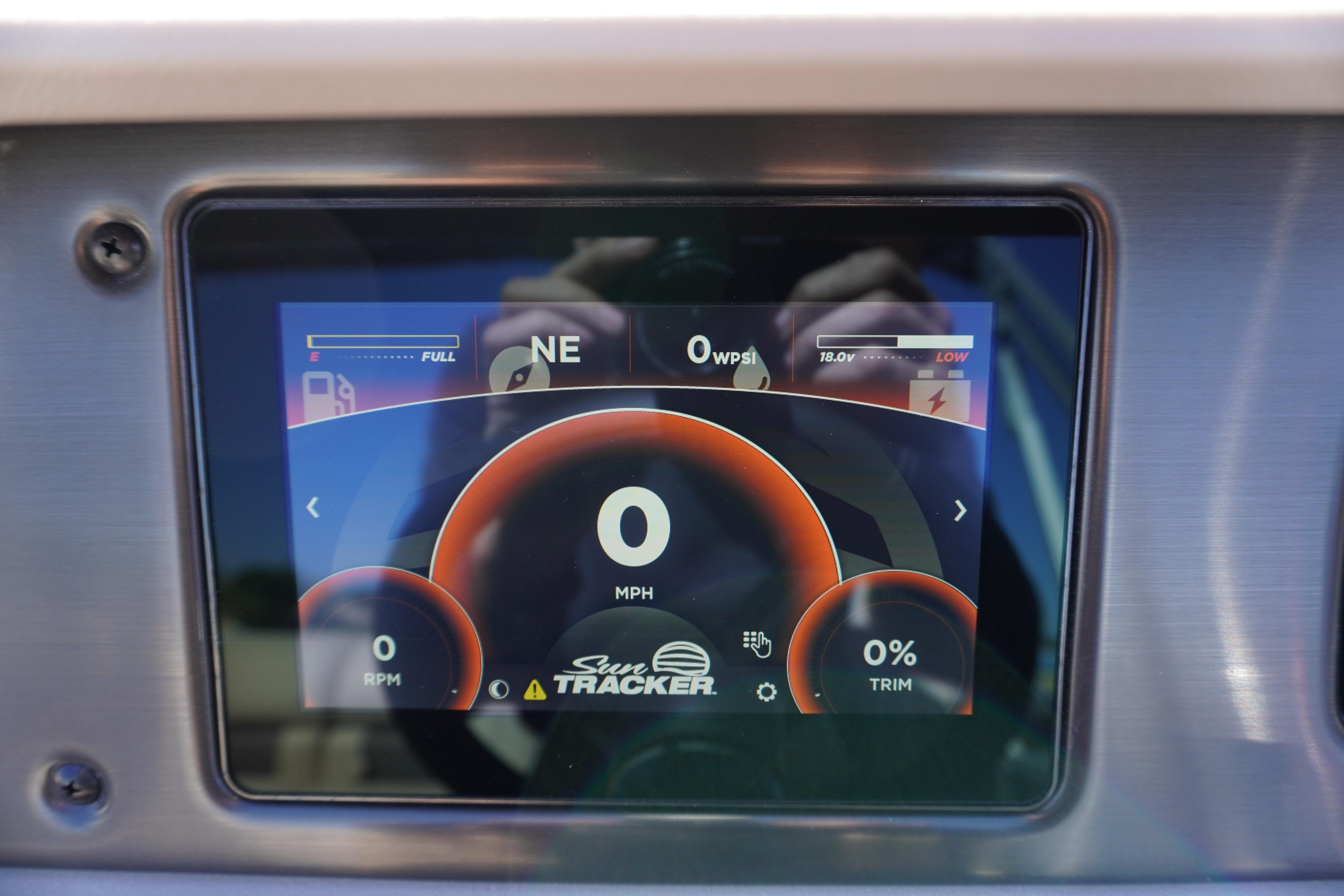 2024 Sun Tracker Party Barge 20 DLX digital dashboard display showing speed and fuel levels.