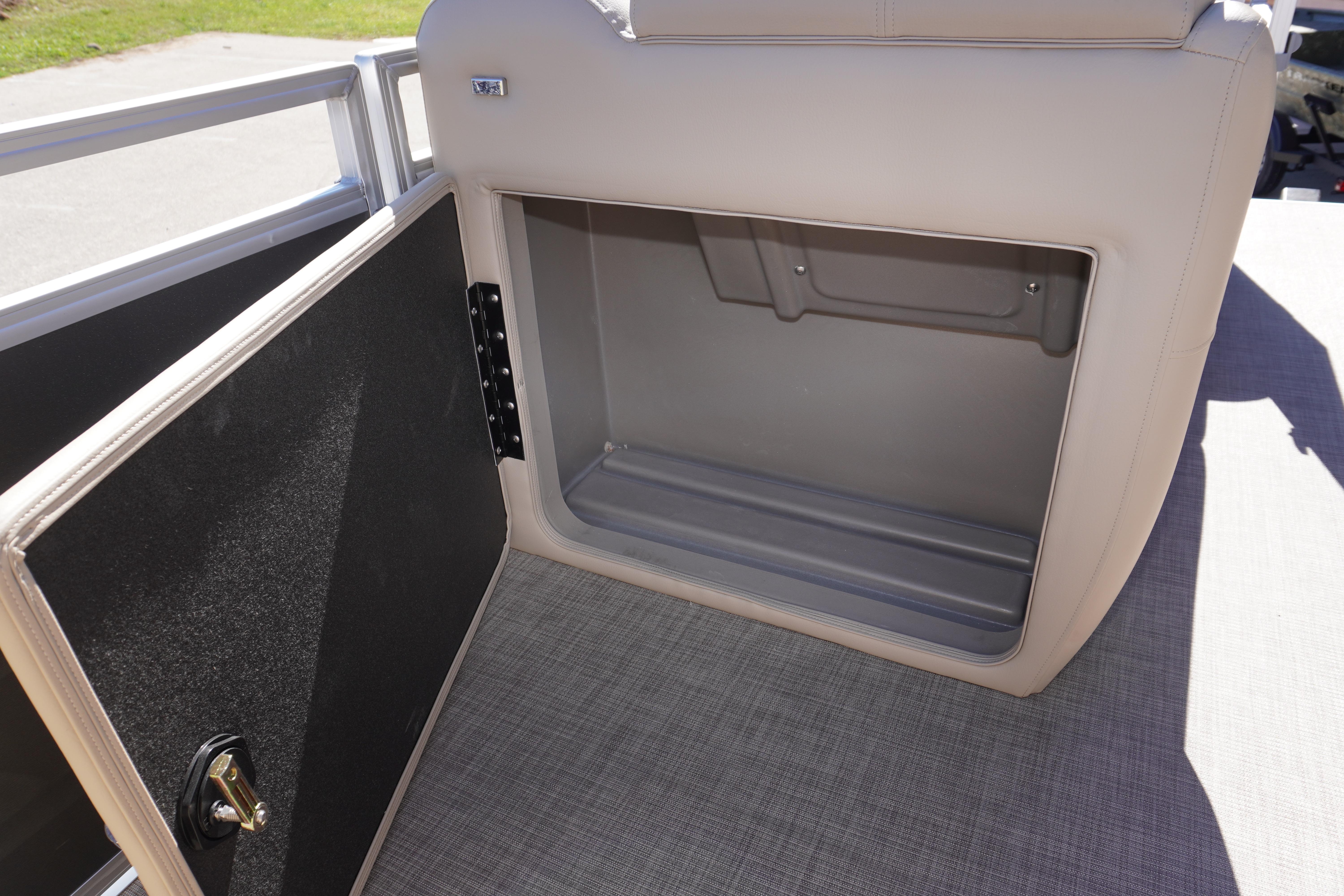 2024 Sun Tracker Party Barge 20 DLX storage compartment with open door, showcasing interior space.