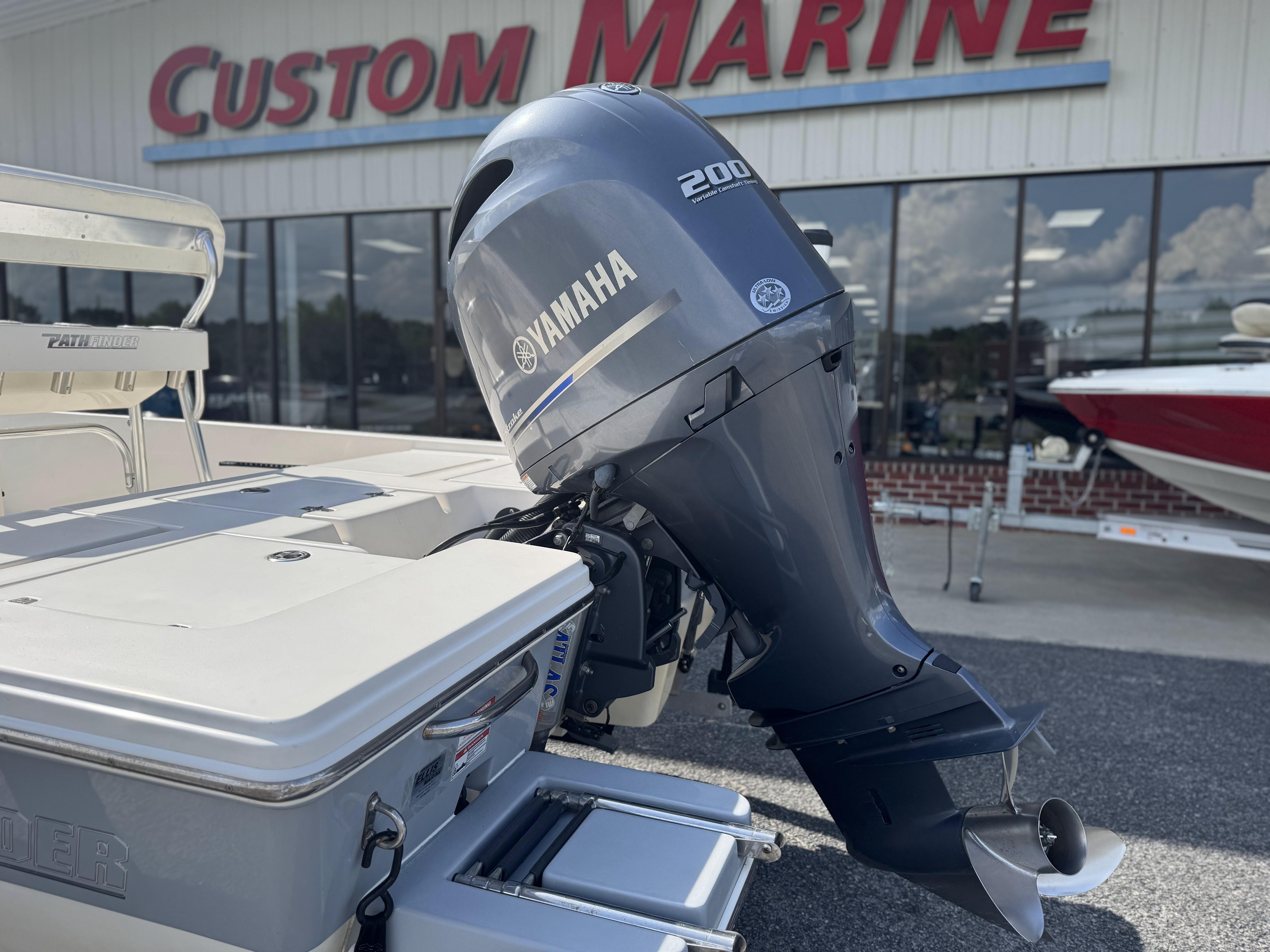 2014 Pathfinder 2200 TRS boat with Yamaha 200 engine at Custom Marine dealership.