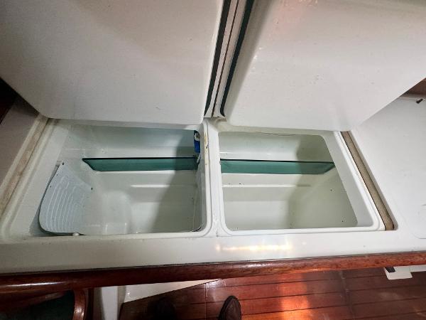 Open storage compartments on 1996 Beneteau Oceanis 40 CC yacht interior.