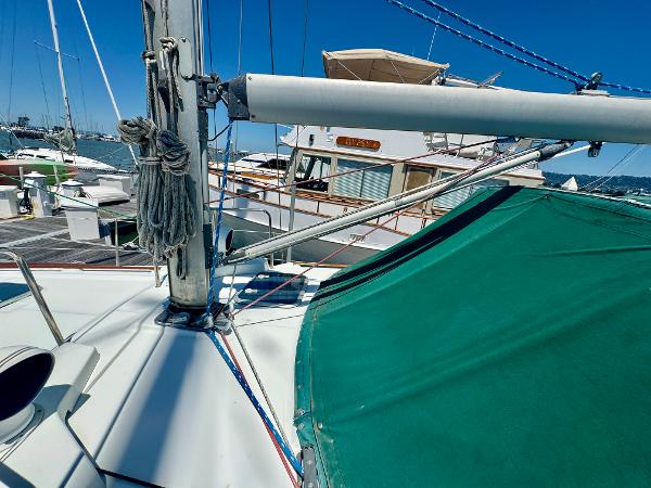 Beneteau Oceanis 40 CC sailboat deck, 1996 model, docked at marina under clear blue sky.
