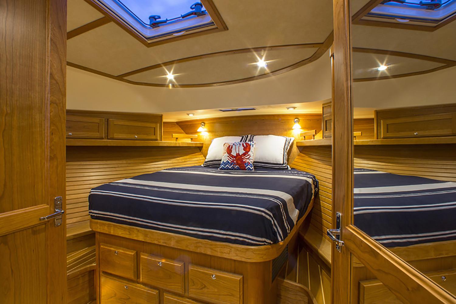 Manufacturer Provided Image: Luxurious cabin interior of 2026 Sabre 38 Salon Express yacht with cozy bedding.
