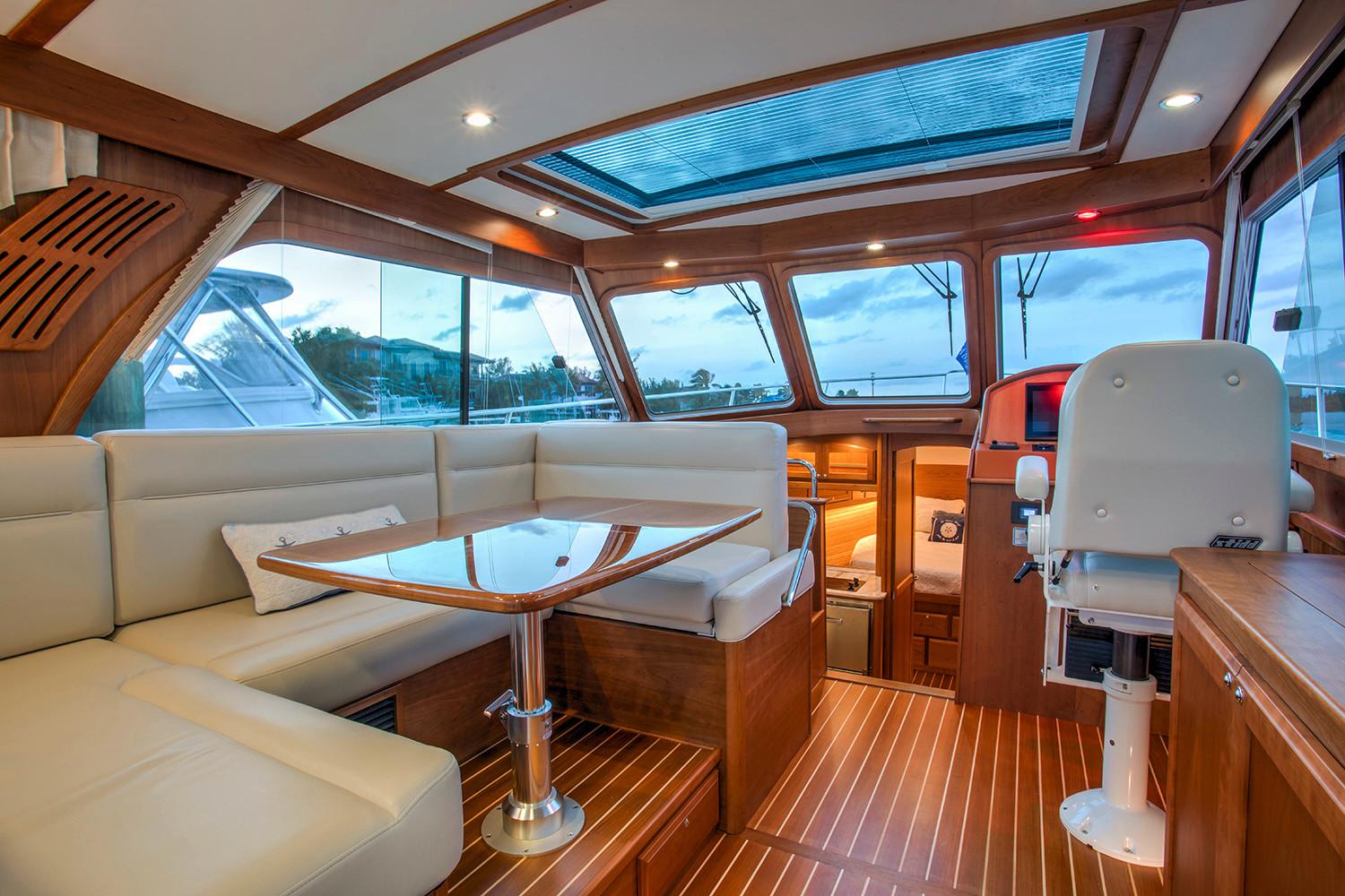 Manufacturer Provided Image: Interior of 2026 Sabre 38 Salon Express yacht with elegant wood finish and panoramic windows.