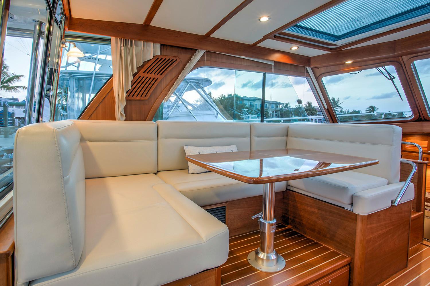 Manufacturer Provided Image: Luxurious interior of 2026 Sabre 38 Salon Express yacht with elegant seating and wooden finishes.