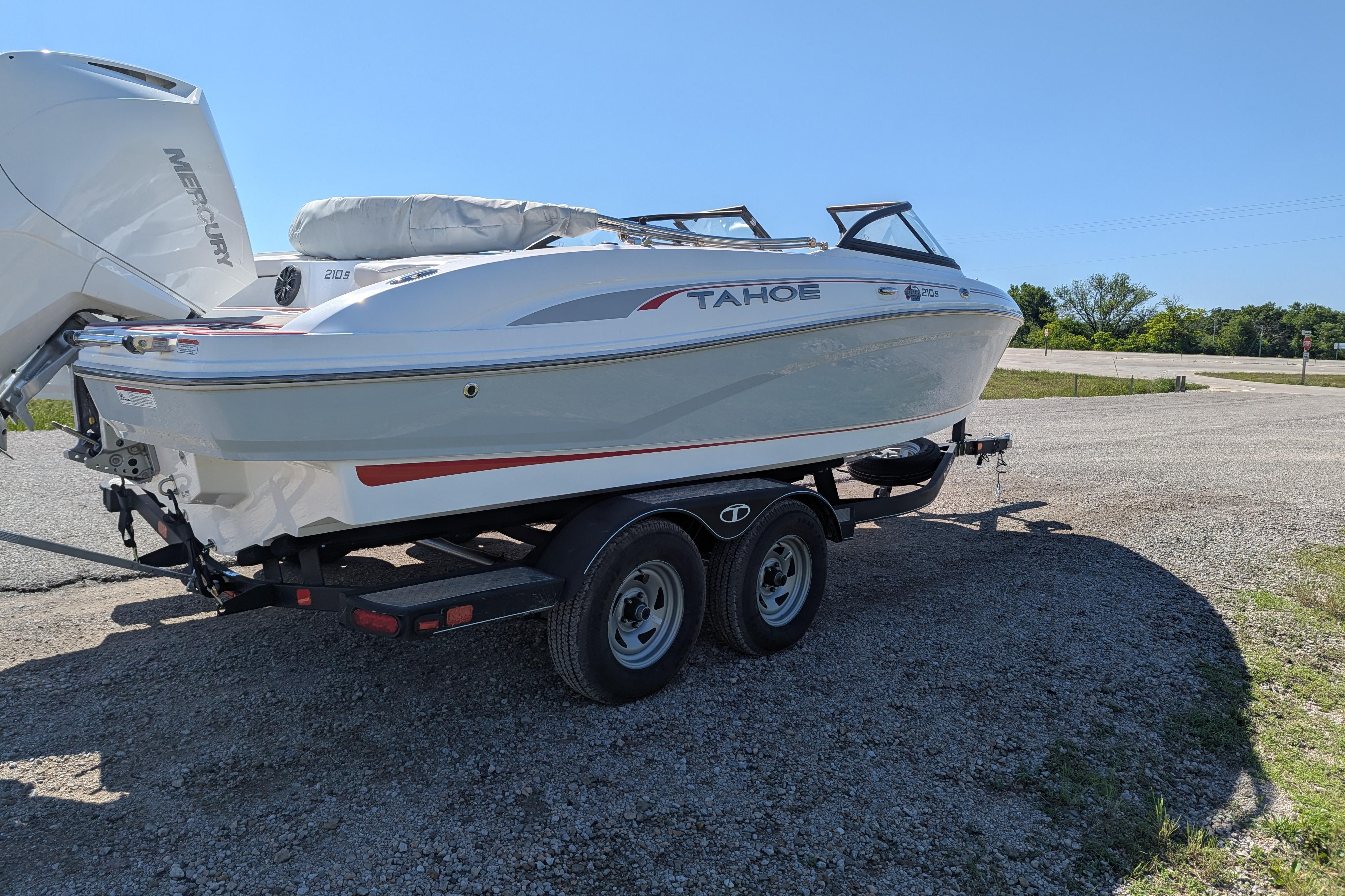 2022 Tahoe 210 S boat on trailer in sunny outdoor setting.