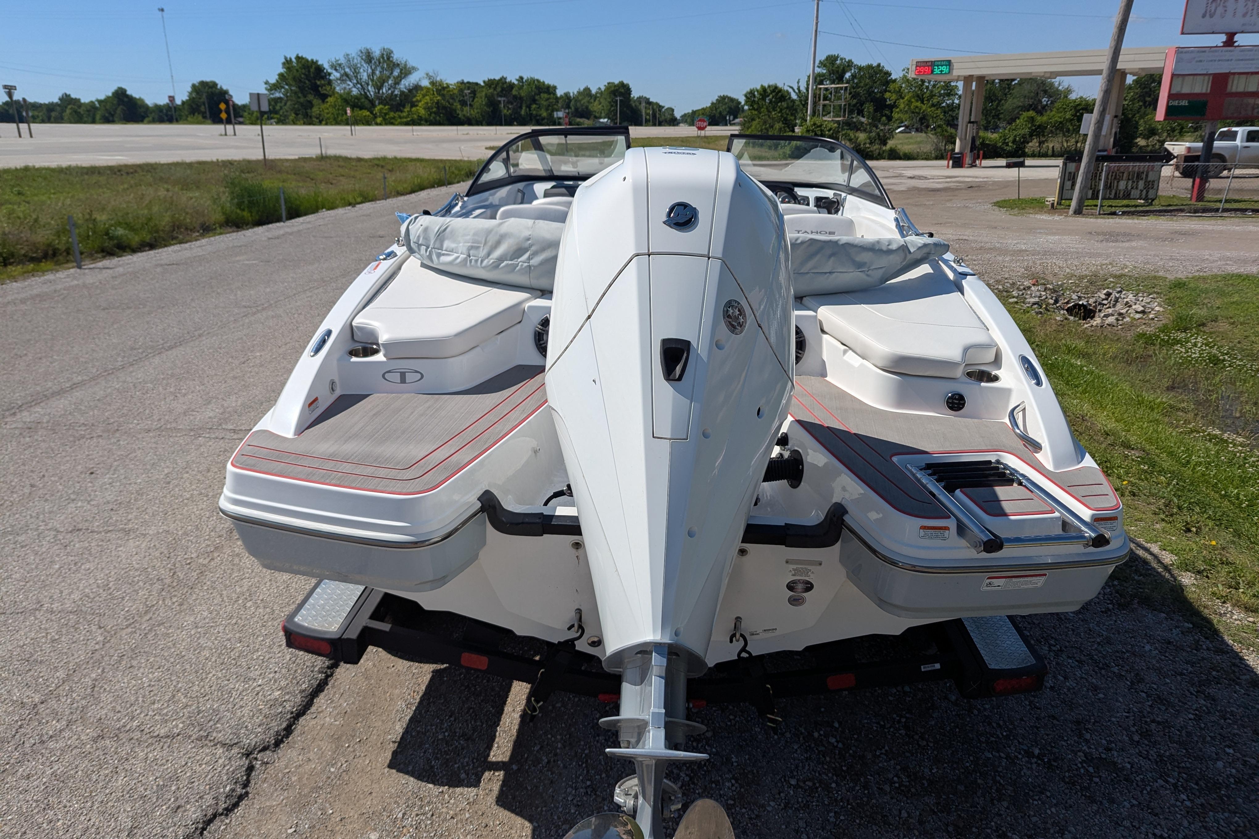 2022 Tahoe 210 S boat on trailer, rear view, parked on roadside.