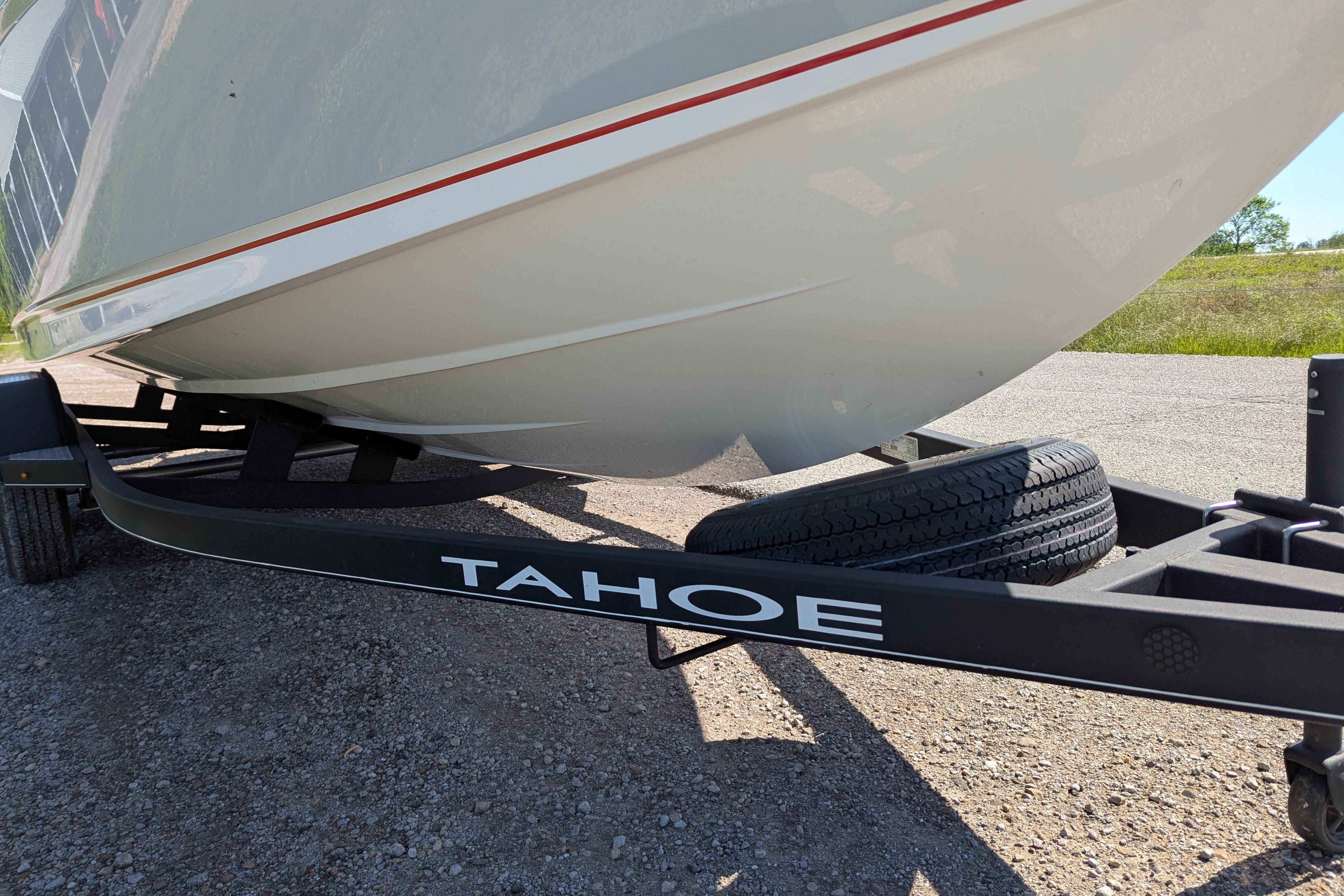 2022 Tahoe 210 S boat on trailer, close-up view of hull and trailer.