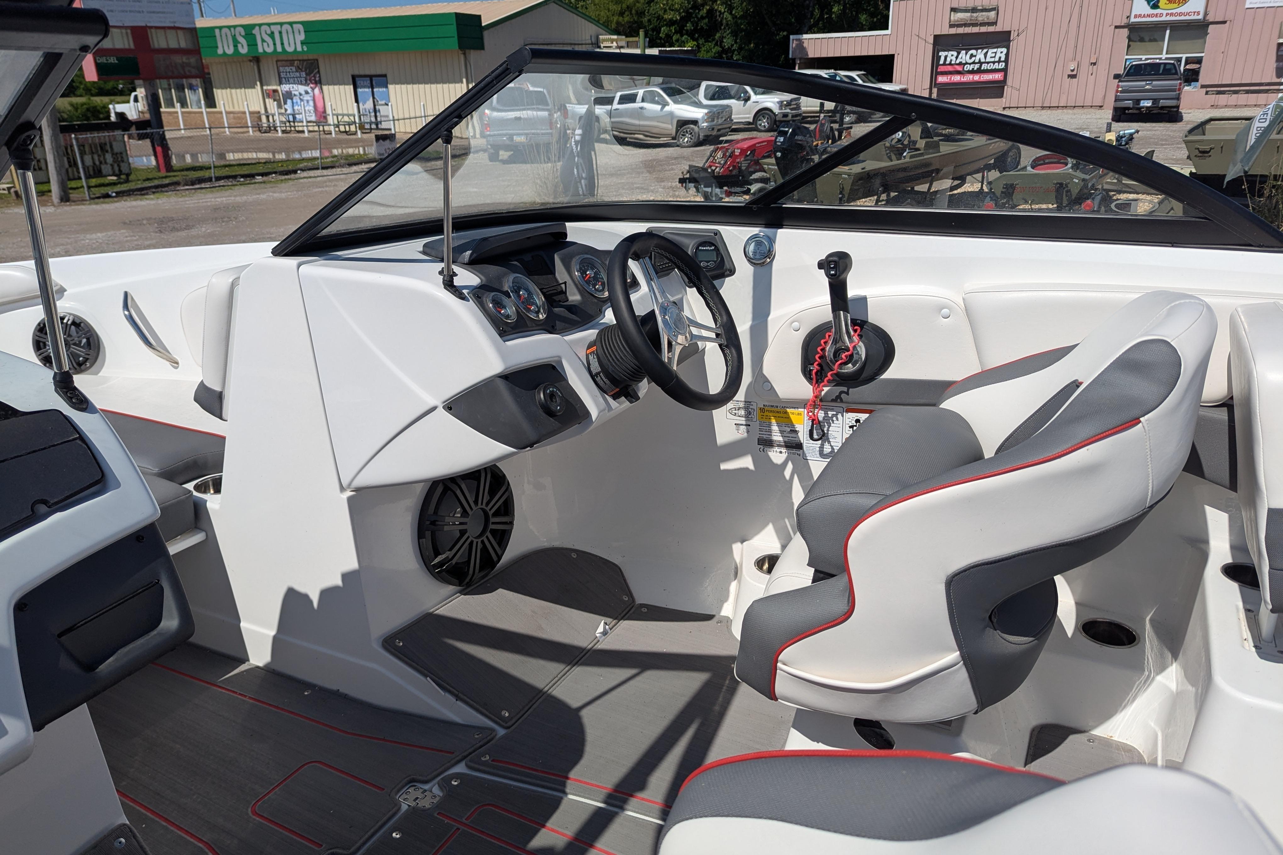2022 Tahoe 210 S boat interior with steering wheel and seating.