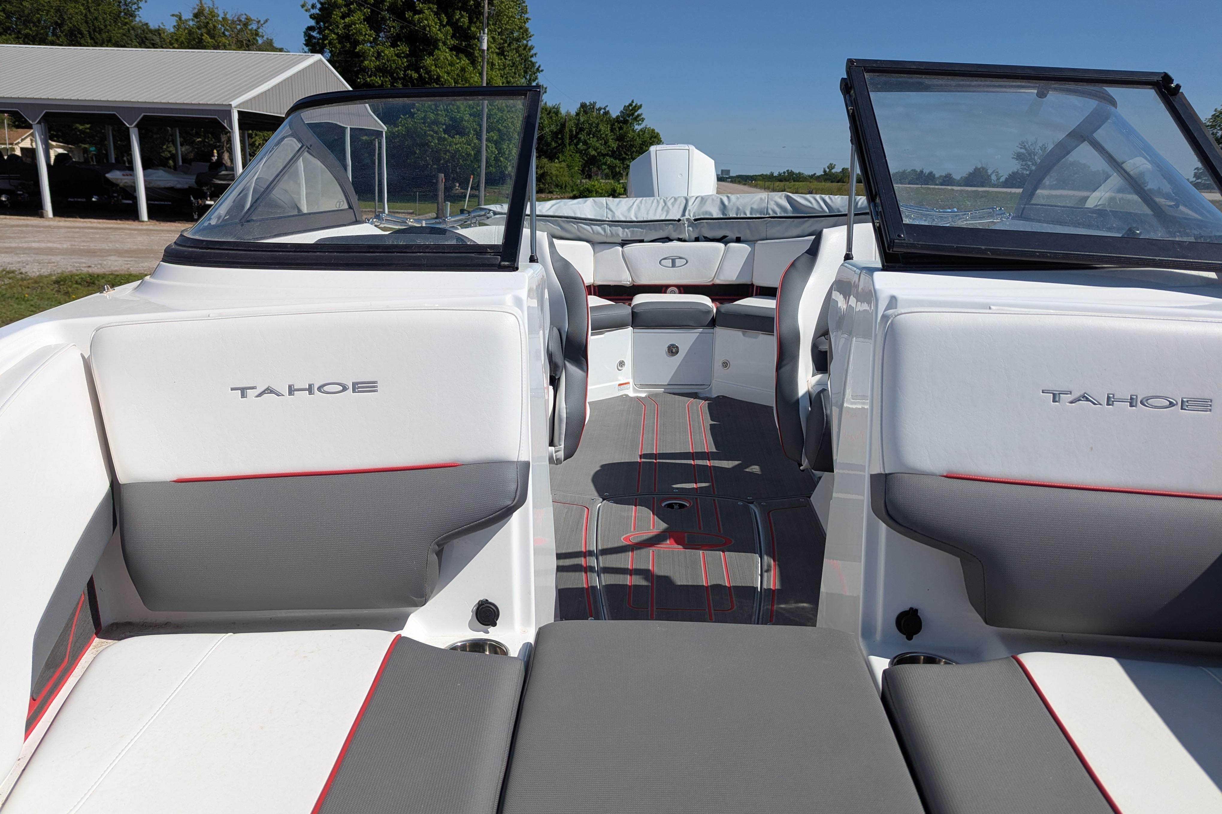 2022 Tahoe 210 S boat interior with gray and white seating, open deck, and windshield.