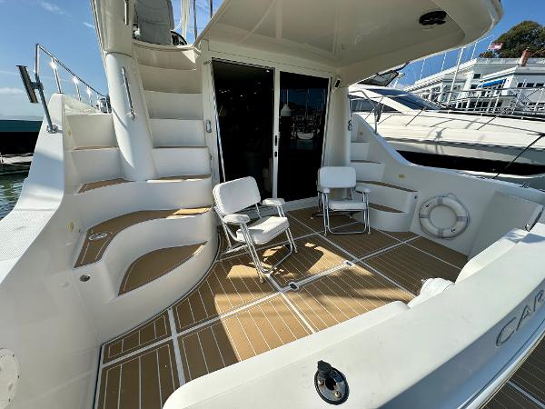 2008 Carver 43 Super Sport yacht deck with seating and stairs.