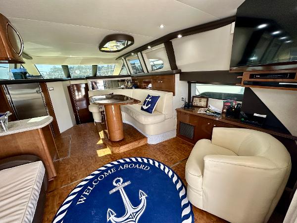 Luxurious interior of 2008 Carver 43 Super Sport yacht with elegant seating and decor.