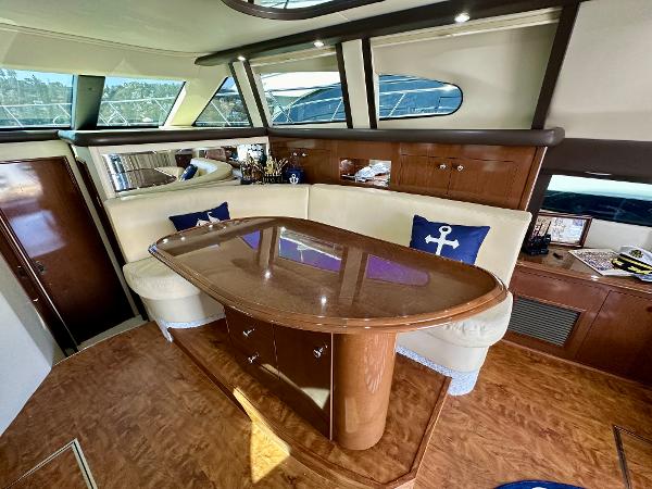 Luxurious interior of 2008 Carver 43 Super Sport yacht with elegant wood finishes.