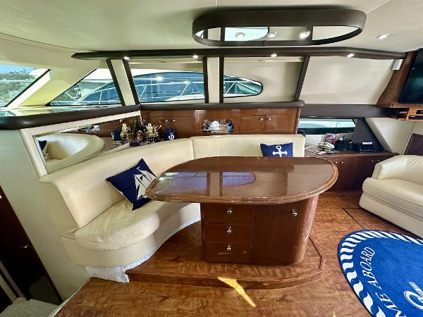 Luxurious interior of 2008 Carver 43 Super Sport yacht with elegant seating and nautical decor.