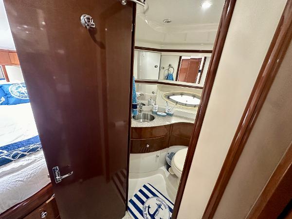2008 Carver 43 Super Sport yacht bathroom with modern fixtures and nautical decor.