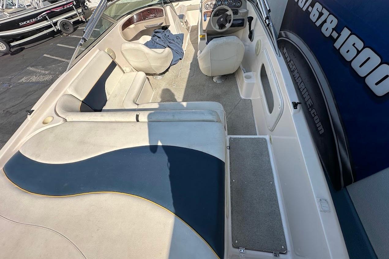 2002 Rinker 212 Captiva boat interior with seating and steering wheel.