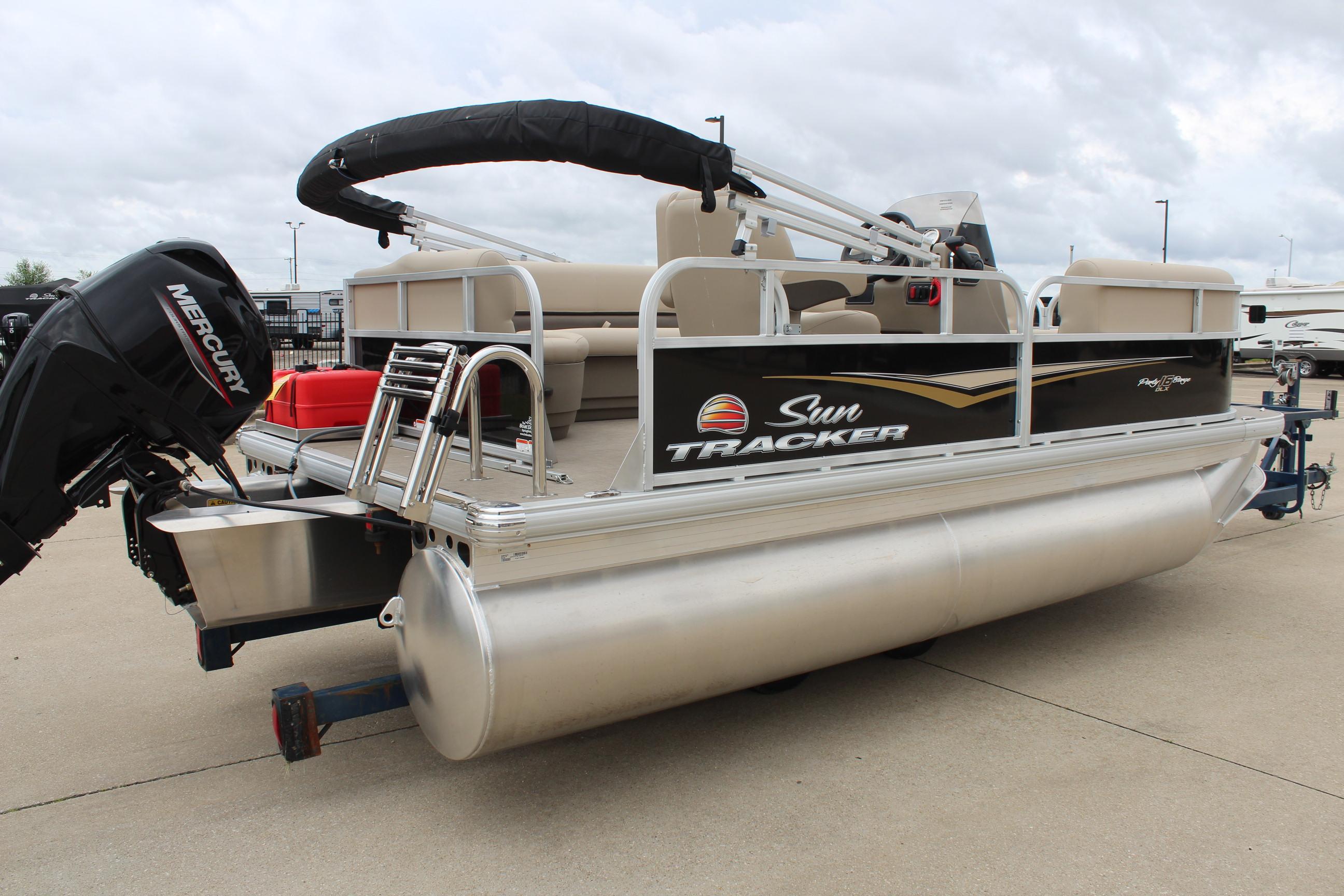 2025 Sun Tracker Party Barge 16 DLX pontoon boat with Mercury outboard motor.
