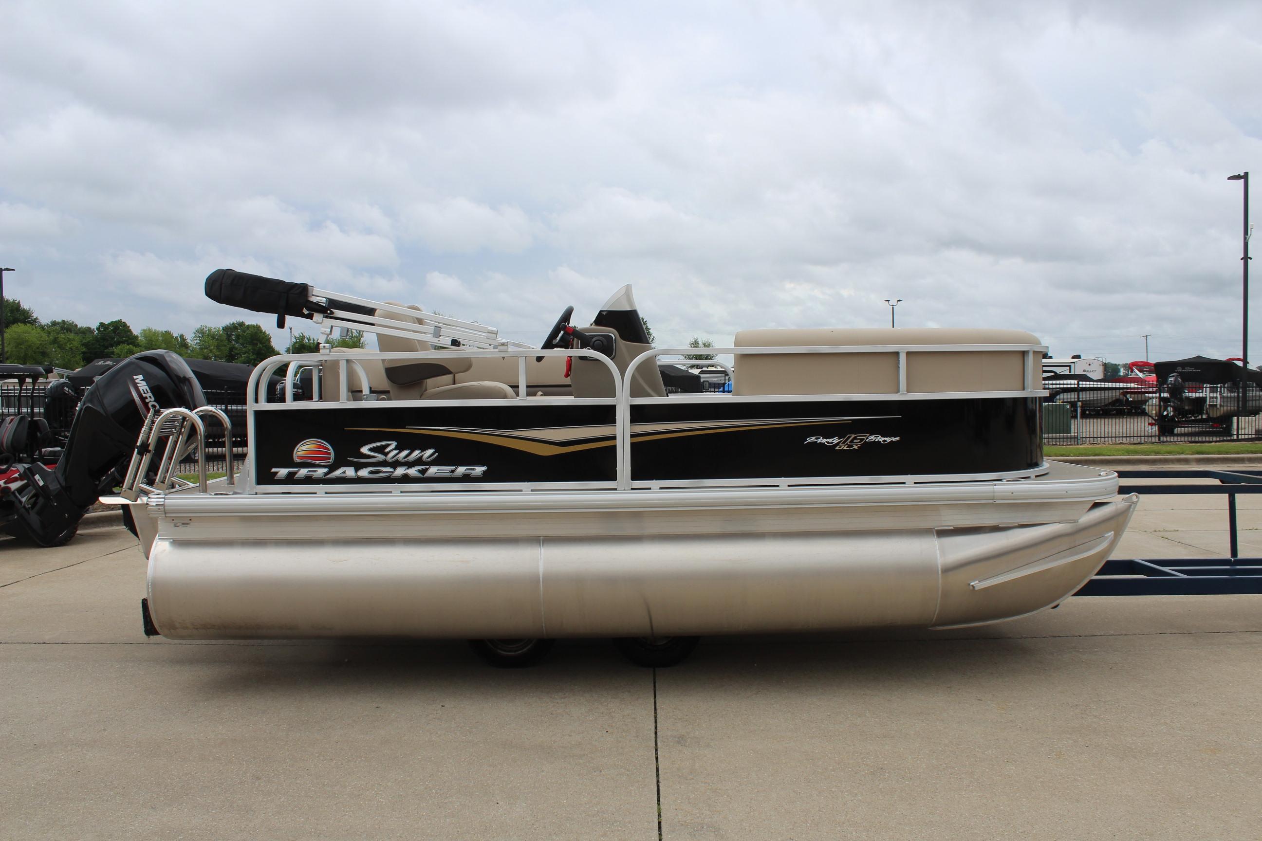 2025 Sun Tracker Party Barge 16 DLX pontoon boat on display outdoors.