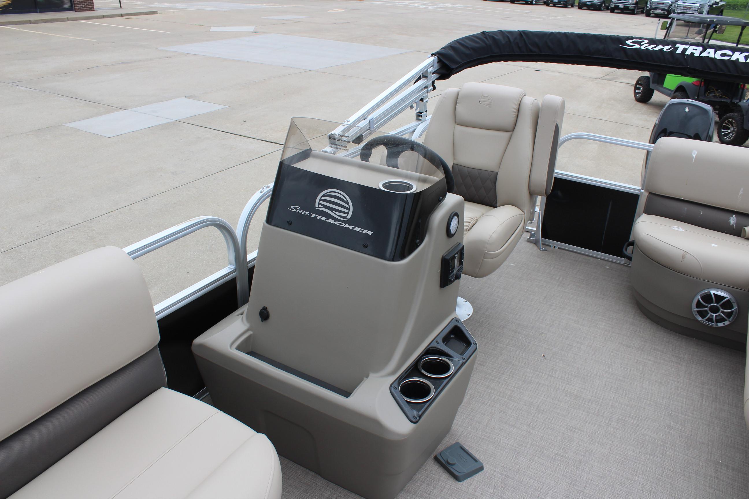 2025 Sun Tracker Party Barge 16 DLX interior with steering console and seating.