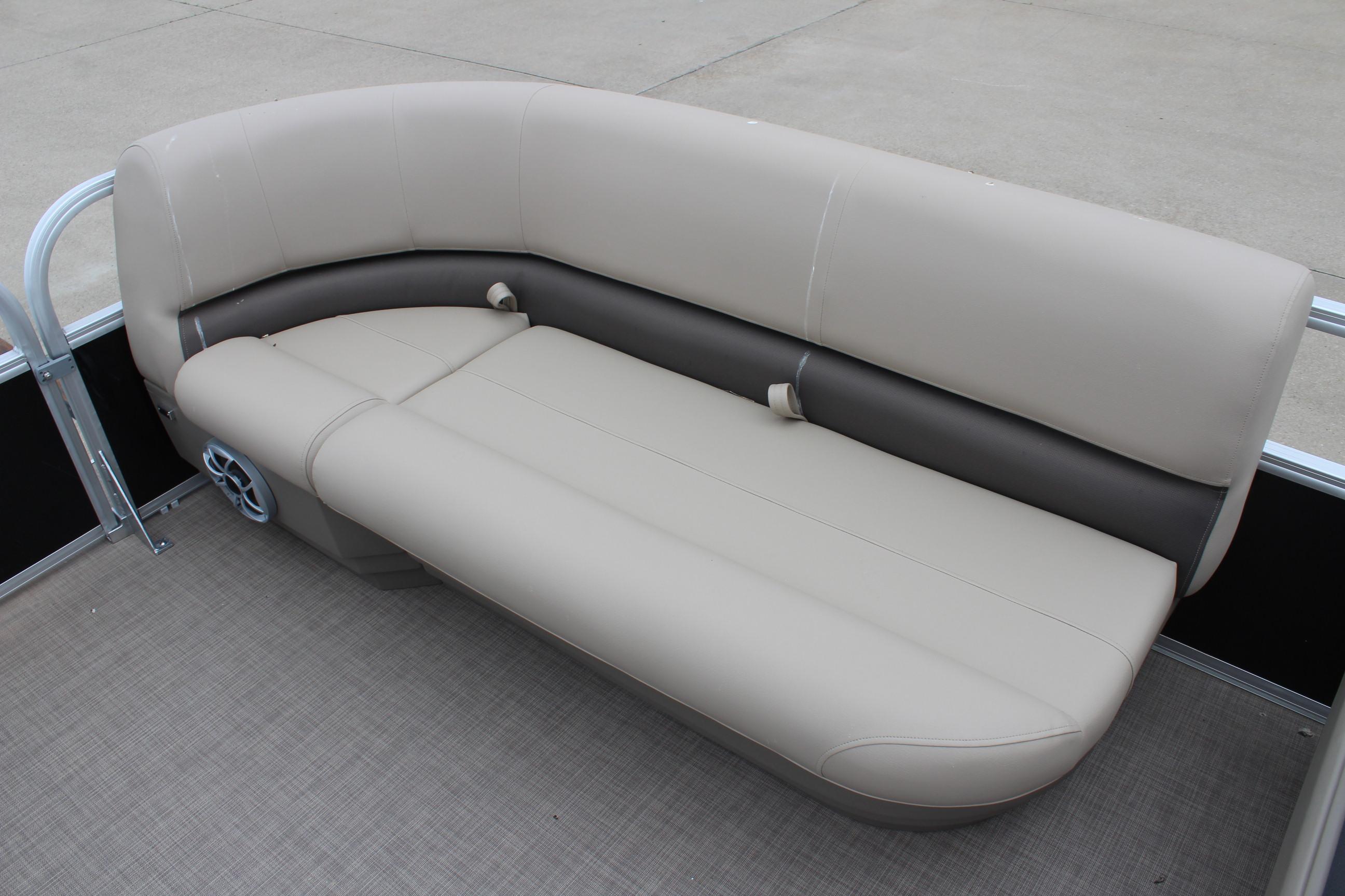 2025 Sun Tracker Party Barge 16 DLX pontoon boat seating, beige and brown upholstery.