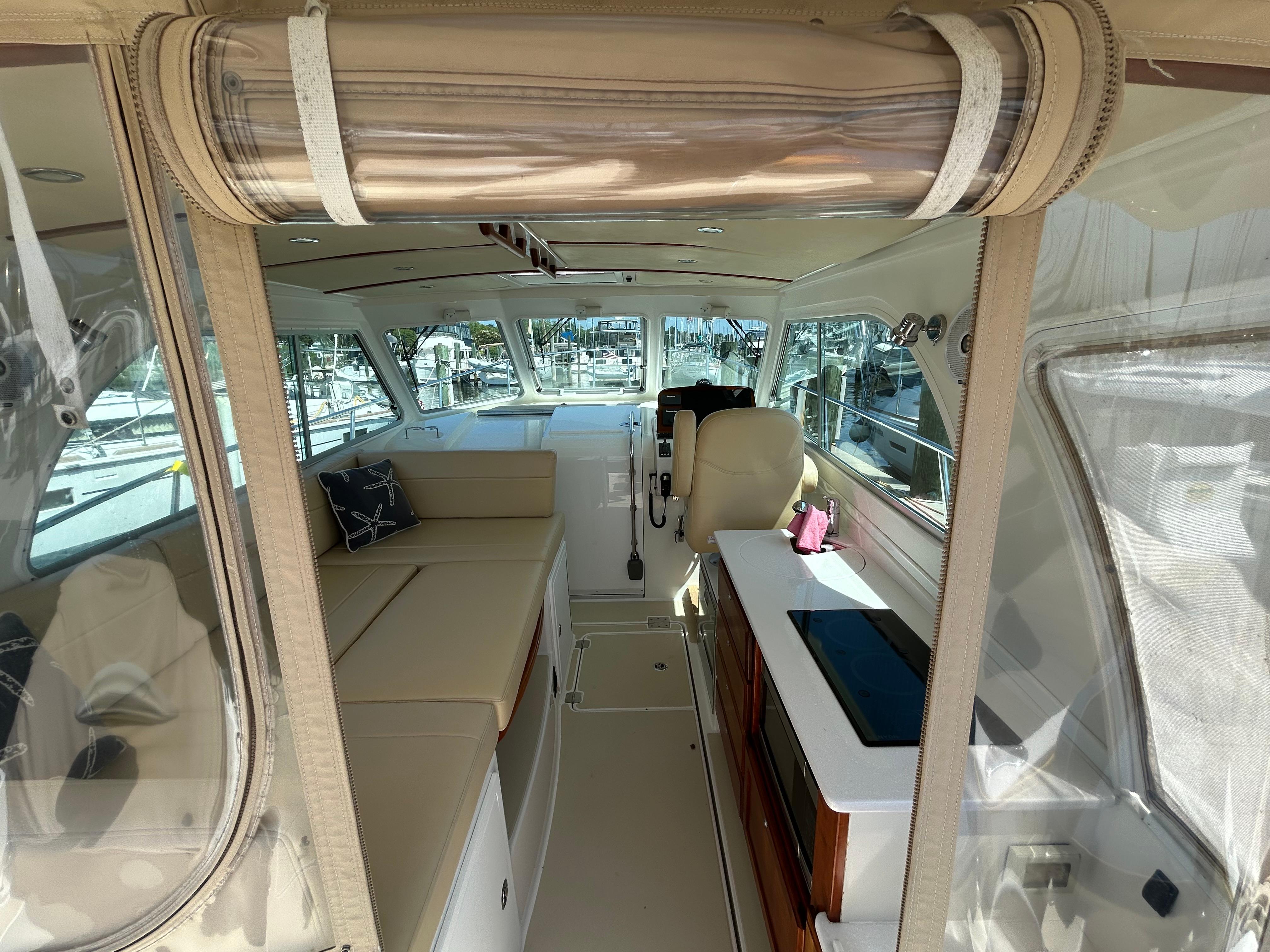 Interior of 2018 Back Cove 32 yacht with beige seating and modern amenities.
