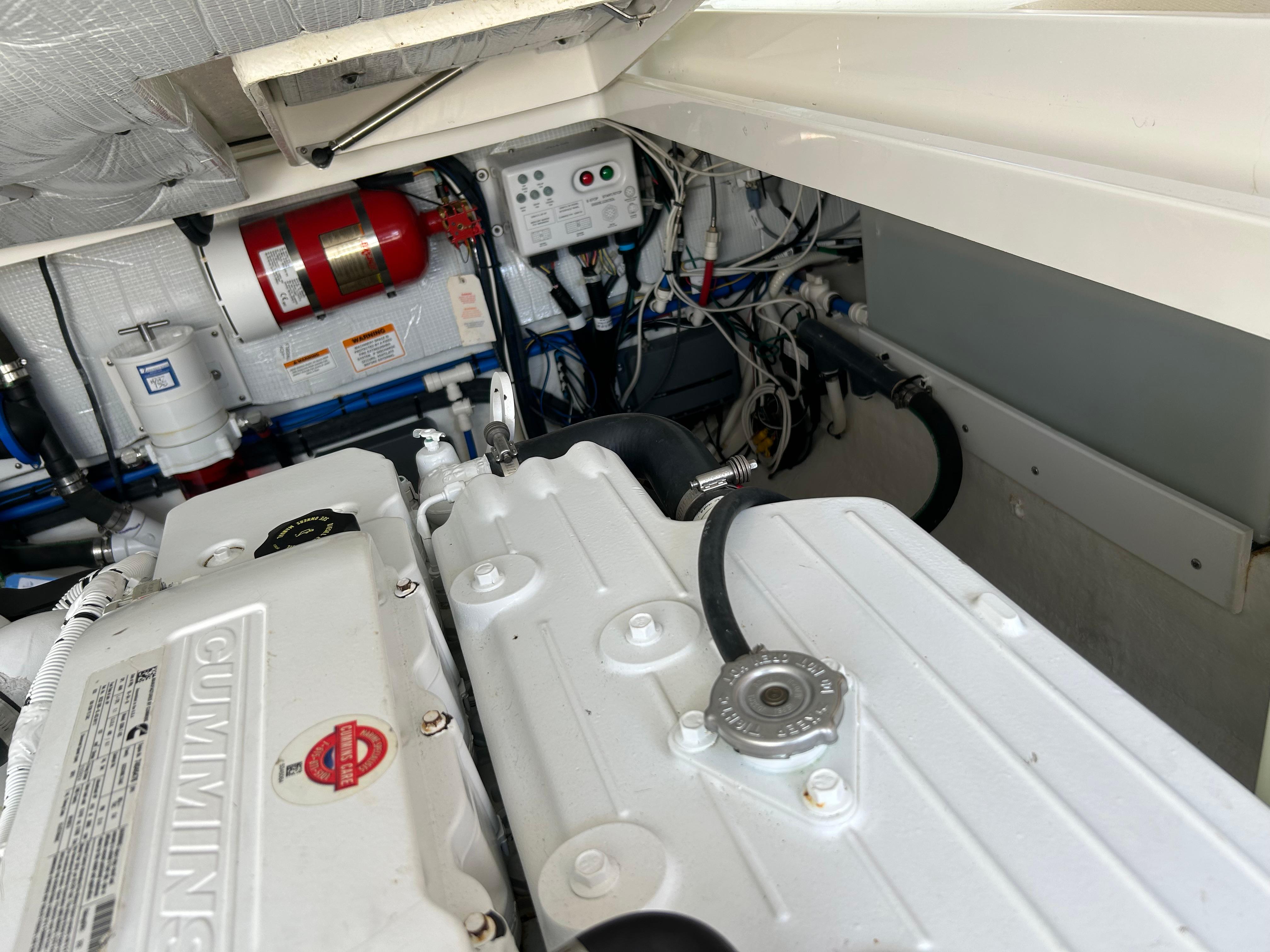Engine compartment of a 2018 Back Cove 32 boat, featuring Cummins engine components.