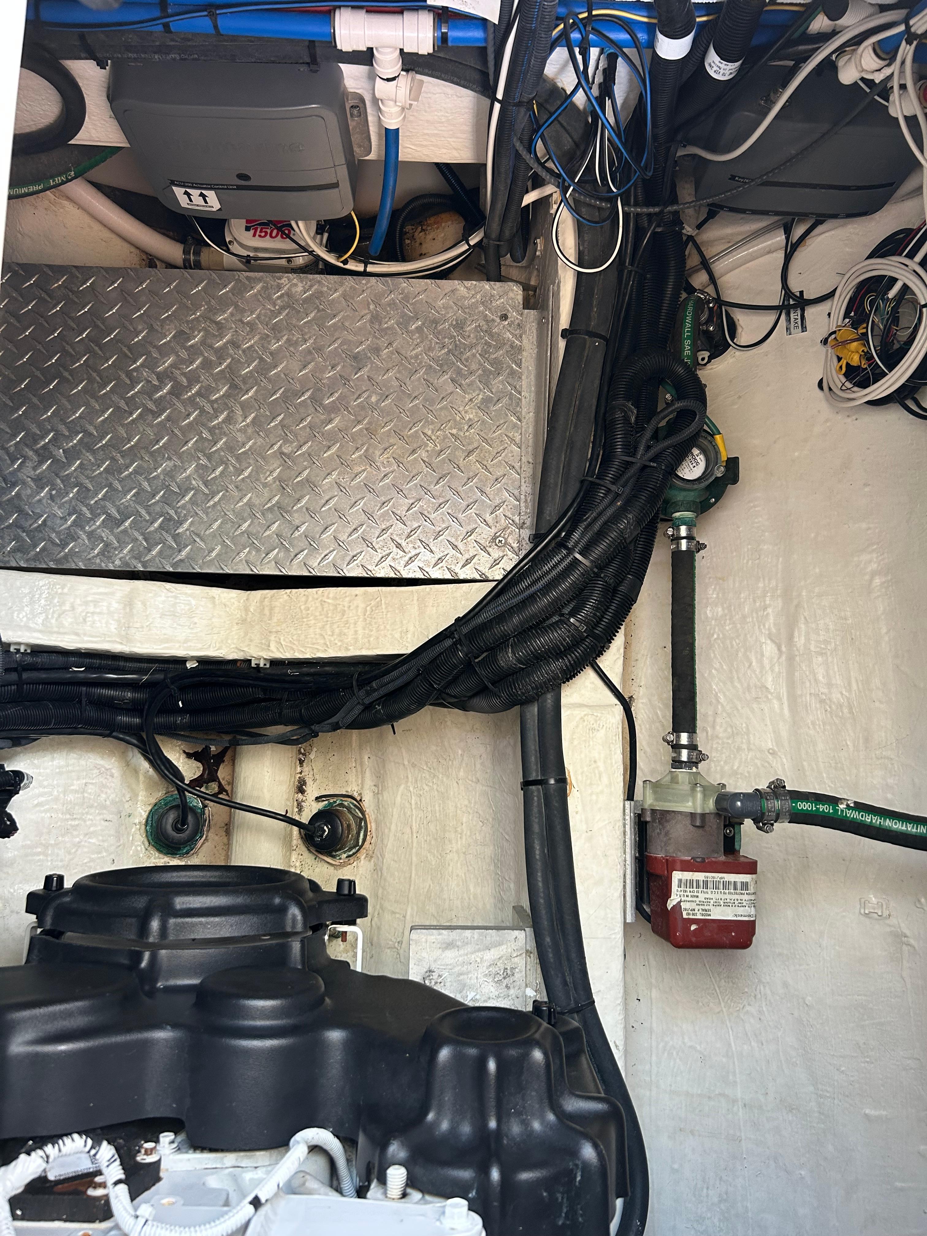 Engine compartment of a 2018 Back Cove 32 boat, showing wiring and components.
