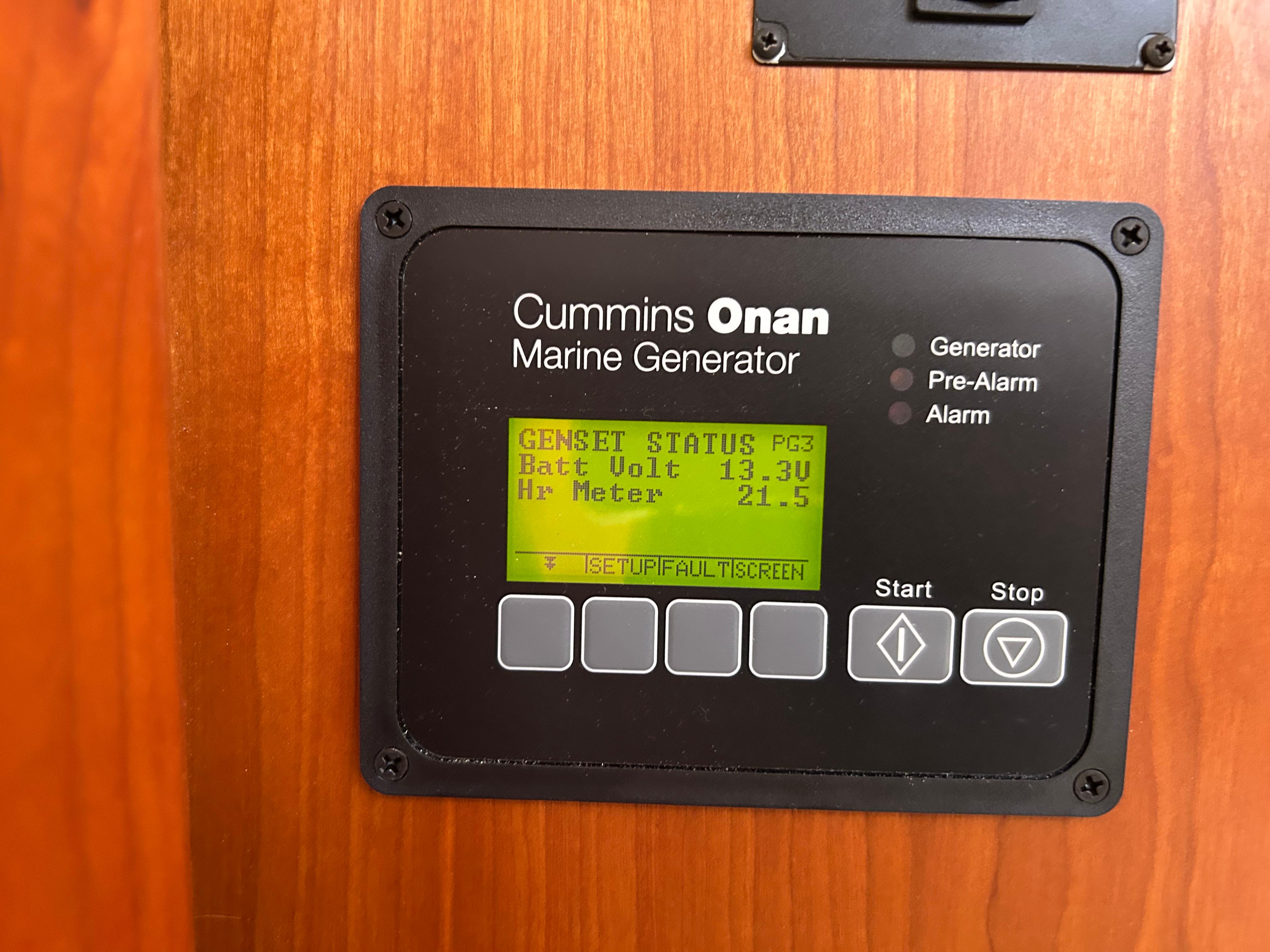 Cummins Onan marine generator display on 2018 Back Cove 32 boat, showing battery voltage and hour meter.