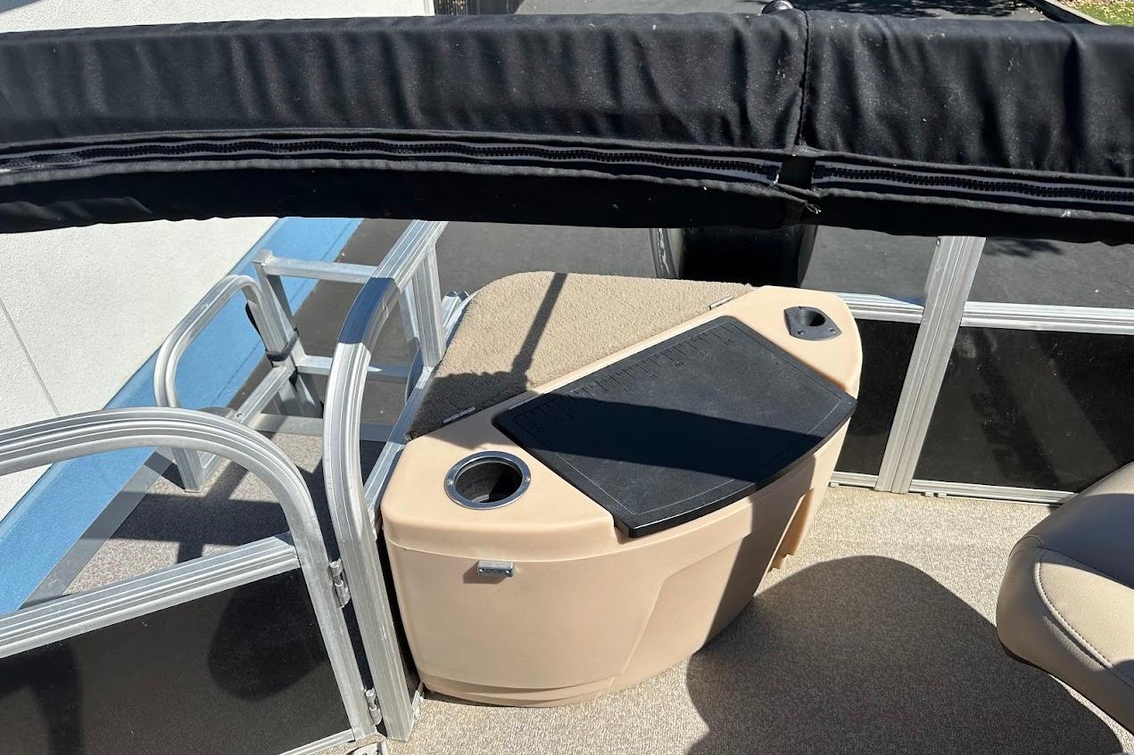 2019 Sun Tracker Bass Buggy 18 DLX pontoon boat interior with seating and storage.