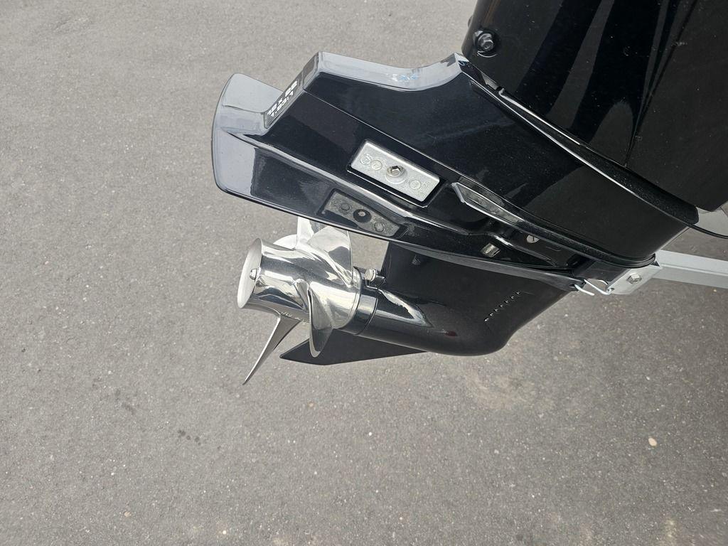2025 Mako Pro Skiff 15 CC outboard motor with shiny propeller.