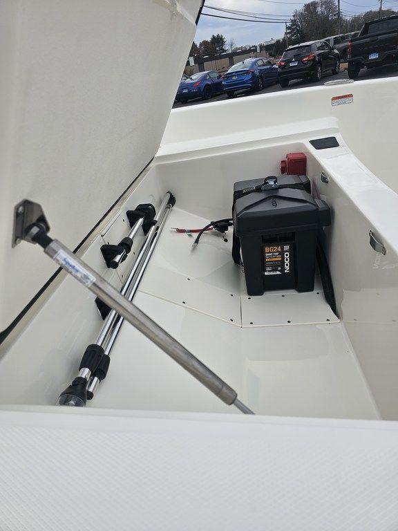 2025 Mako Pro Skiff 15 CC storage compartment with battery and equipment.