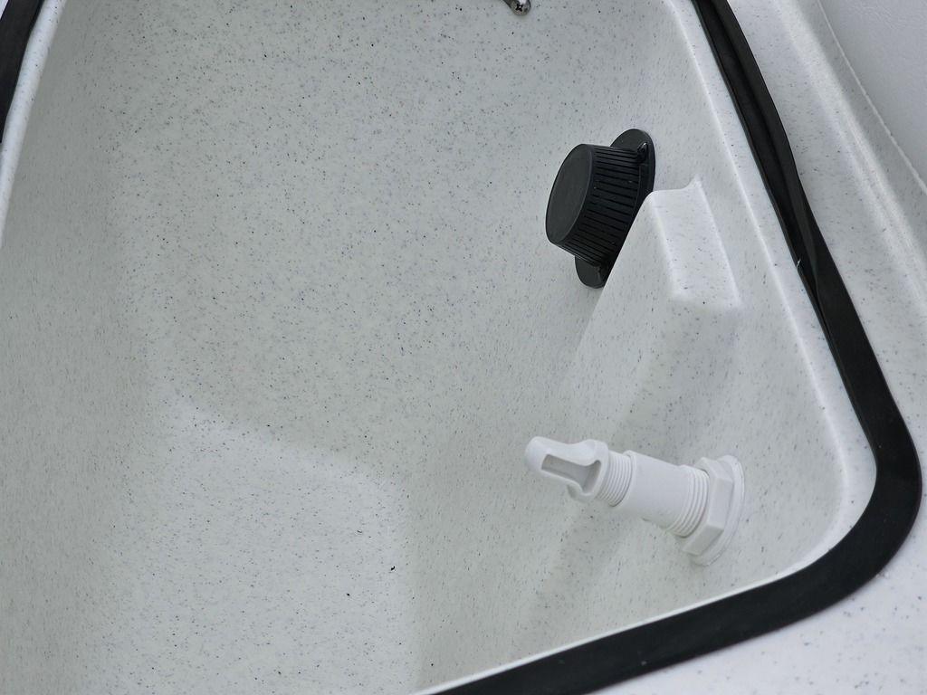 2025 Mako Pro Skiff 15 CC interior detail with drainage plug.