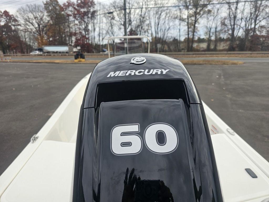 2025 Mako Pro Skiff 15 CC with Mercury 60 horsepower engine in parking lot.