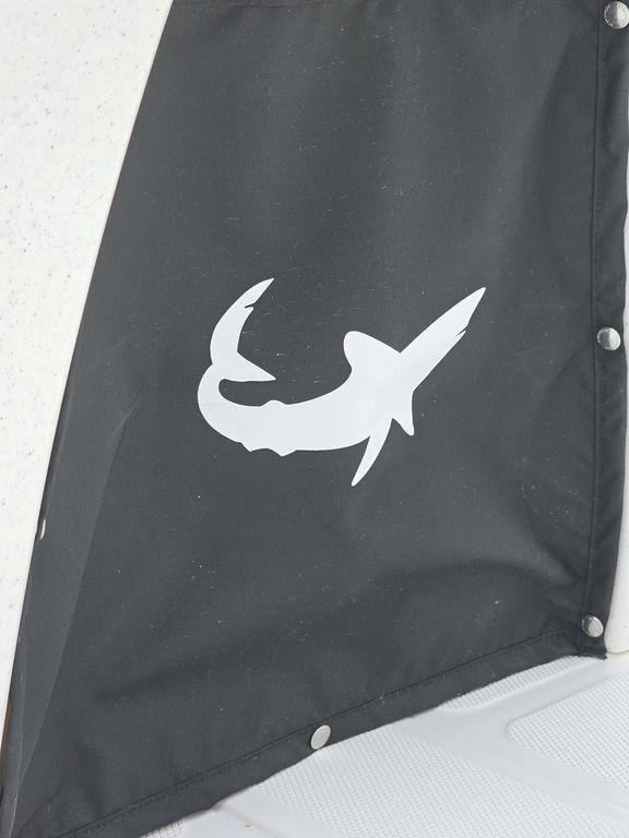 2025 Mako Pro Skiff 15 CC with shark logo on black fabric.