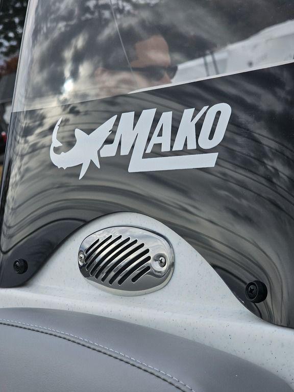 2025 Mako Pro Skiff 15 CC boat windshield with logo and speaker detail.